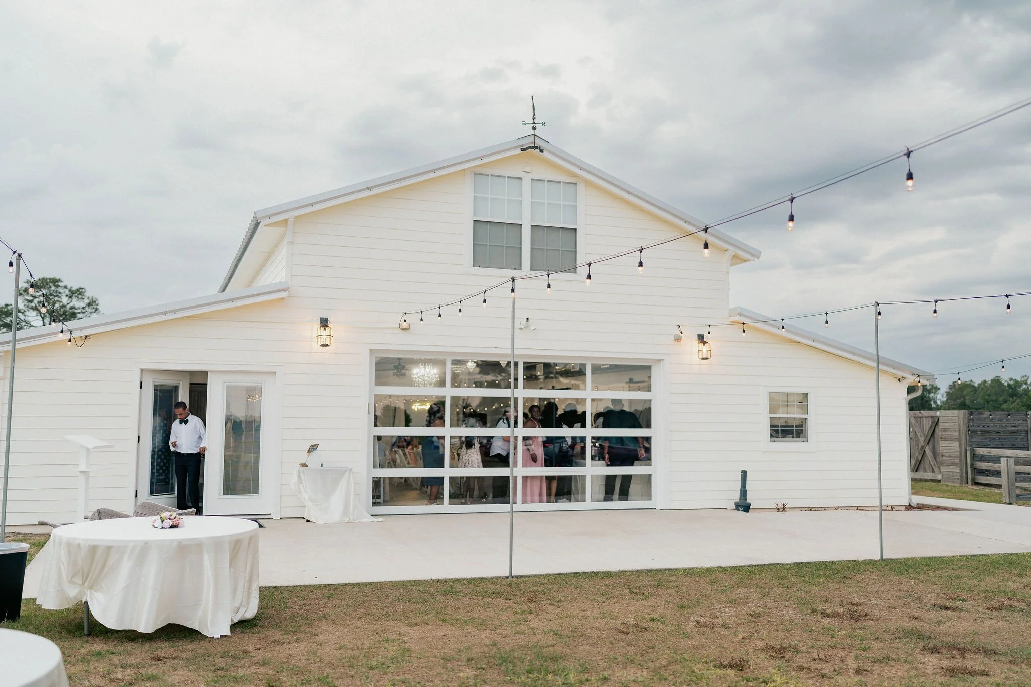 Bride and groom portrait at Brannan’s Barn wedding venue in Jacksonville Florida captured during a 2026 wedding with rustic barn and golden hour light by ARG Foto