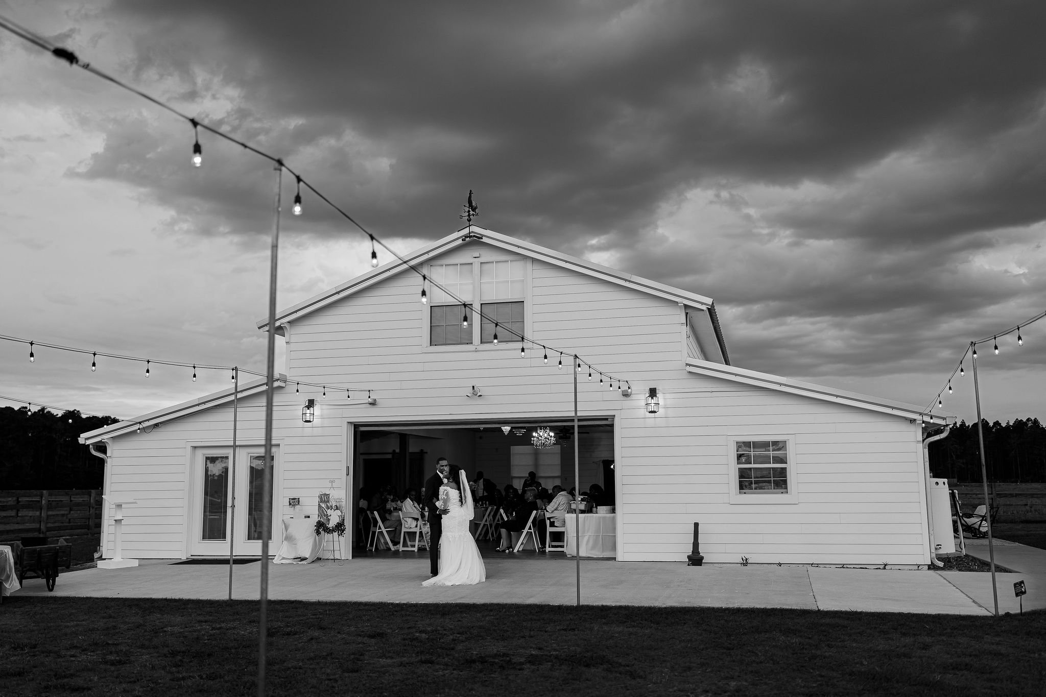 Bride and groom portrait at Brannan’s Barn wedding venue in Jacksonville Florida captured during a 2026 wedding with rustic barn and golden hour light by ARG Foto