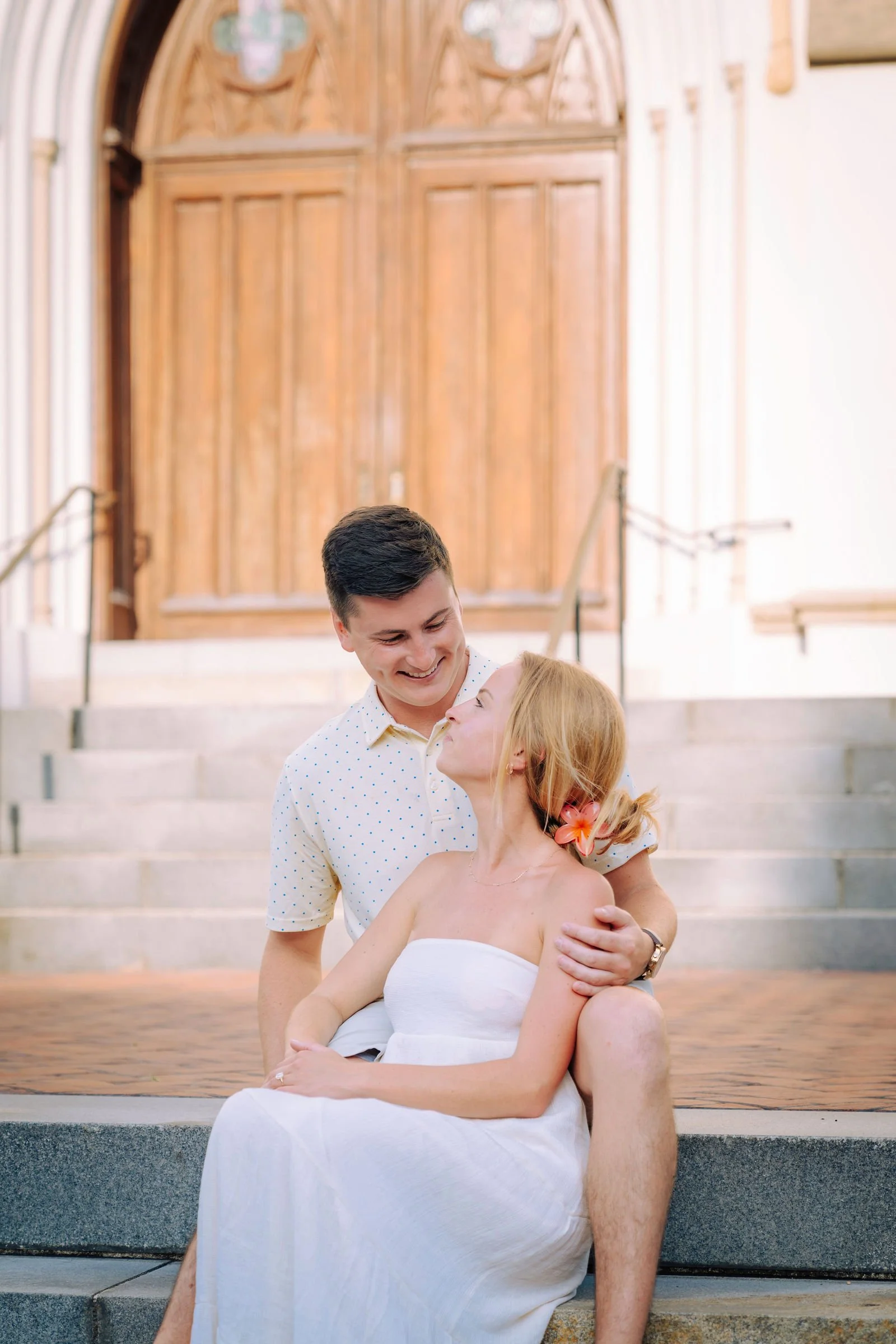 just engaged couple posing in cathedral in savannah ga.jpg
