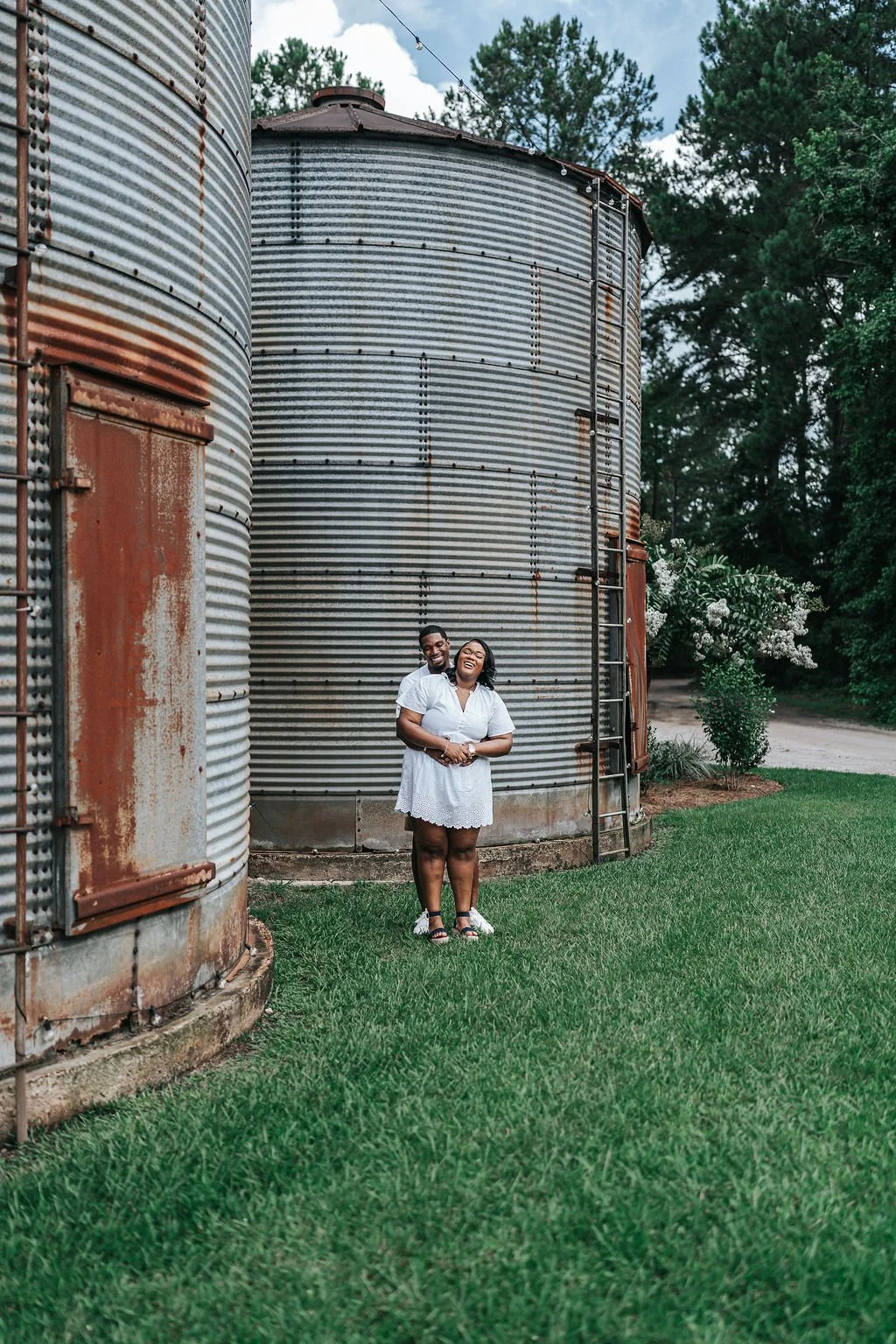 Couple engagement portraits in pine forest at Chande Pines Pembroke Georgia cinematic photography
