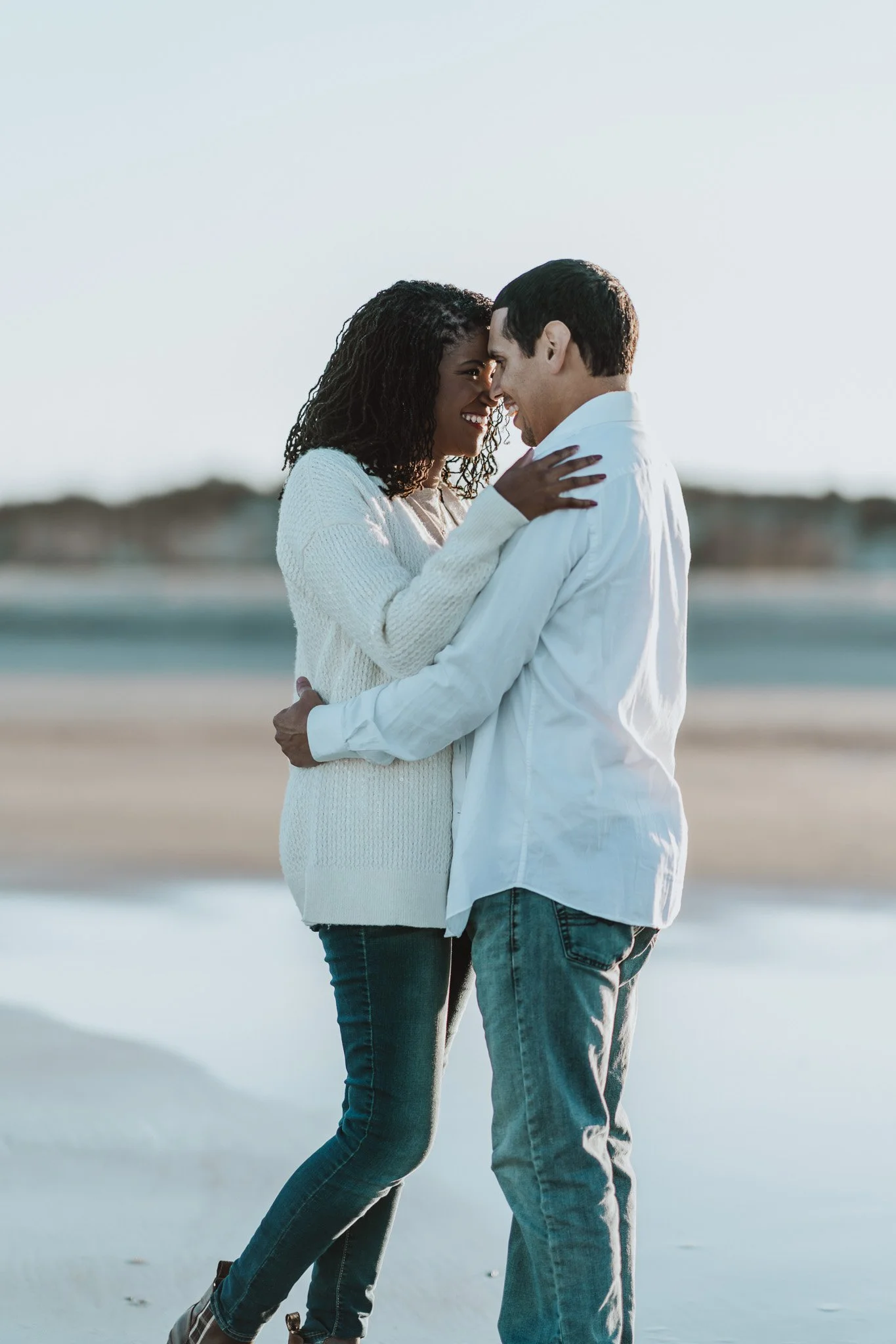 Savannah GA just married couple bride and groom touching foreheads and looking at each other on Tybee Island cinematic wedding photography by ARG Foto