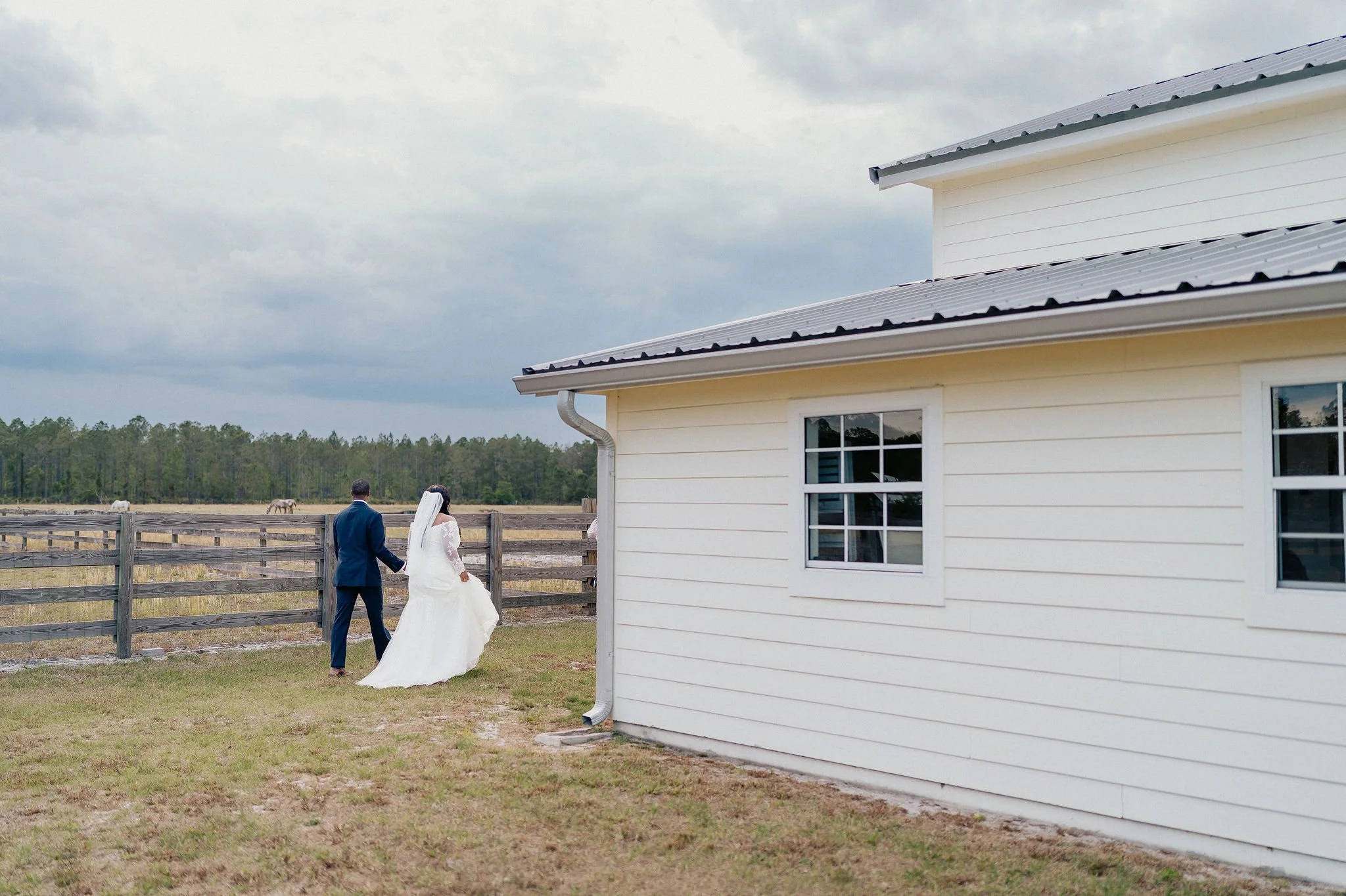 Bride and groom portrait at Brannan’s Barn wedding venue in Jacksonville Florida captured during a 2026 wedding with rustic barn and golden hour light by ARG Foto