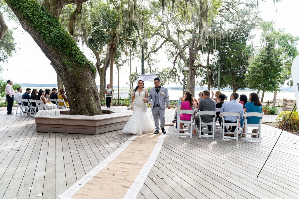 Couple portrait at Oyster Factory Park in Bluffton, South Carolina, during a 2025 wedding—capturing the waterfront beauty of the May River and the timeless Lowcountry atmosphere in an editorial, cinematic style by ARG Foto.