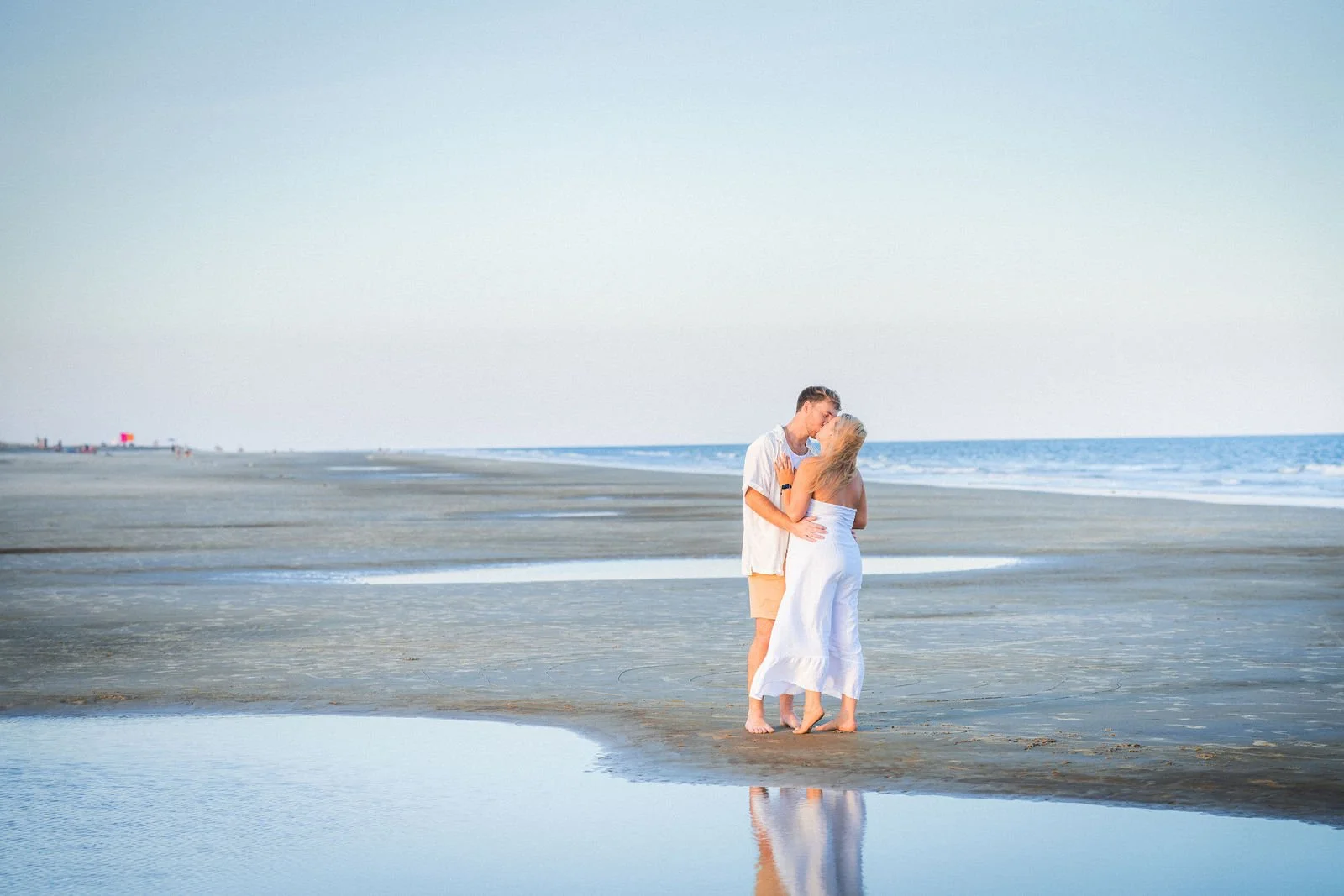 newly engaged couple hugging at beach hilton head sc.jpg