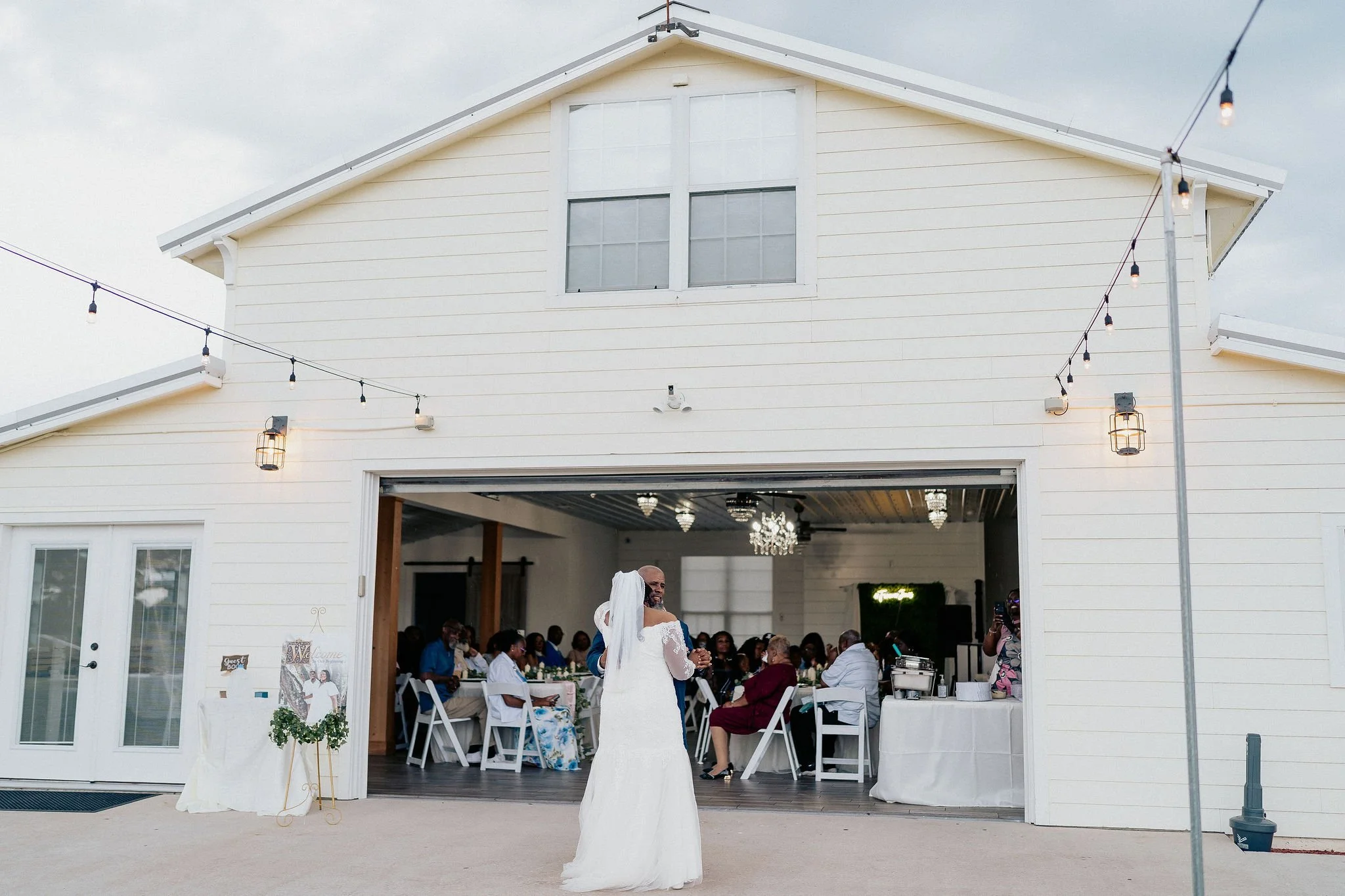 Bride and groom portrait at Brannan’s Barn wedding venue in Jacksonville Florida captured during a 2026 wedding with rustic barn and golden hour light by ARG Foto