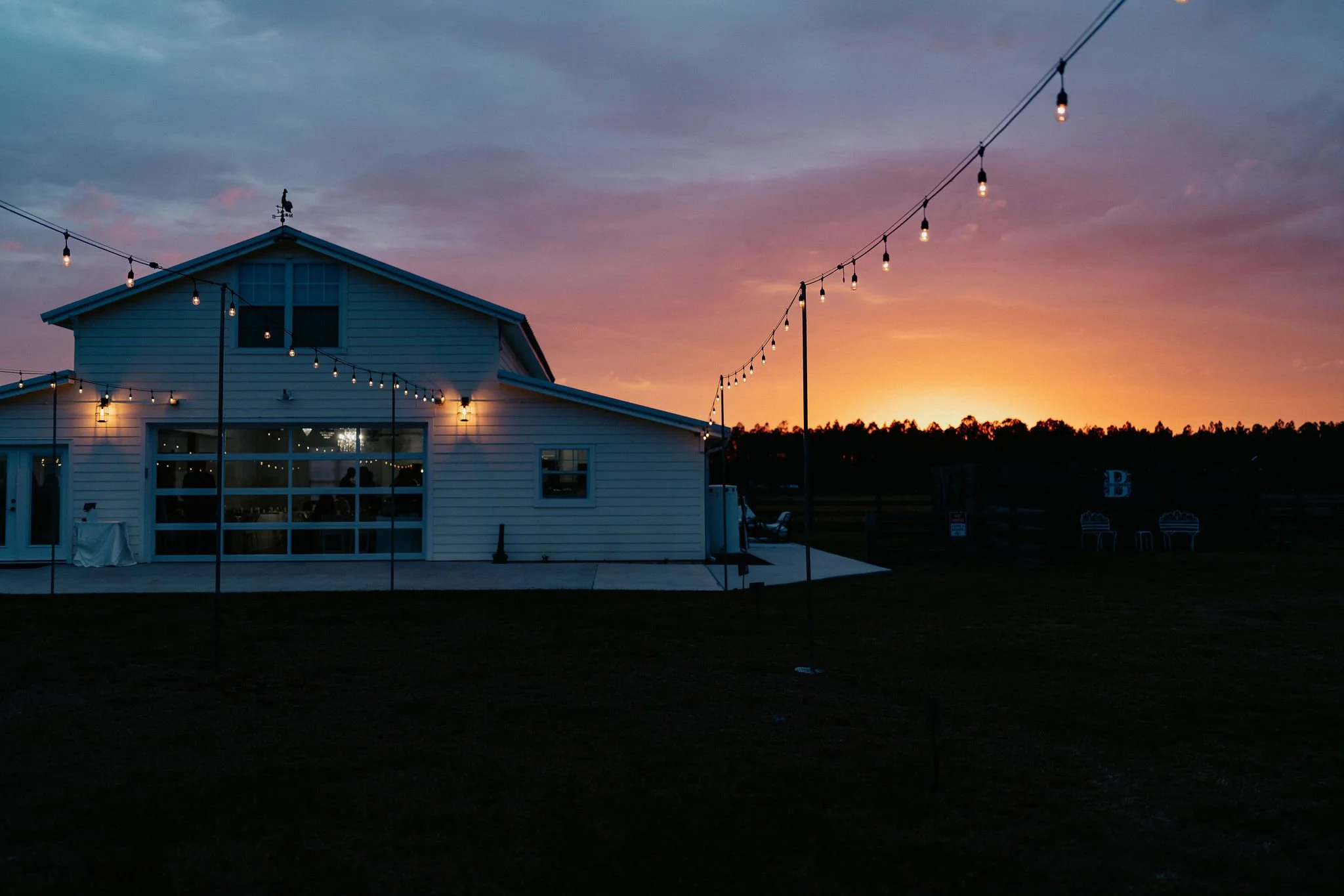Bride and groom portrait at Brannan’s Barn wedding venue in Jacksonville Florida captured during a 2026 wedding with rustic barn and golden hour light by ARG Foto