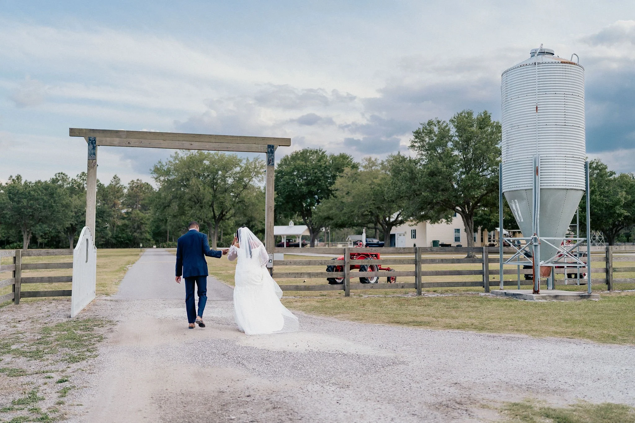 Bride and groom portrait at Brannan’s Barn wedding venue in Jacksonville Florida captured during a 2026 wedding with rustic barn and golden hour light by ARG Foto