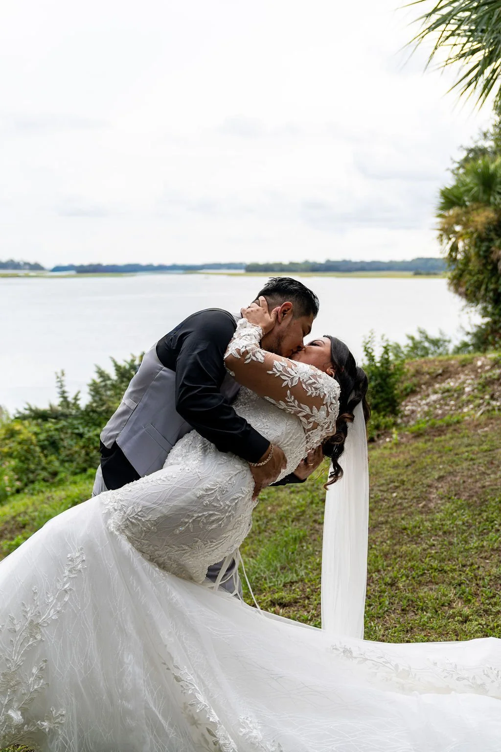 Couple portrait at Oyster Factory Park in Bluffton, South Carolina, during a 2025 wedding—capturing the waterfront beauty of the May River and the timeless Lowcountry atmosphere in an editorial, cinematic style by ARG Foto.