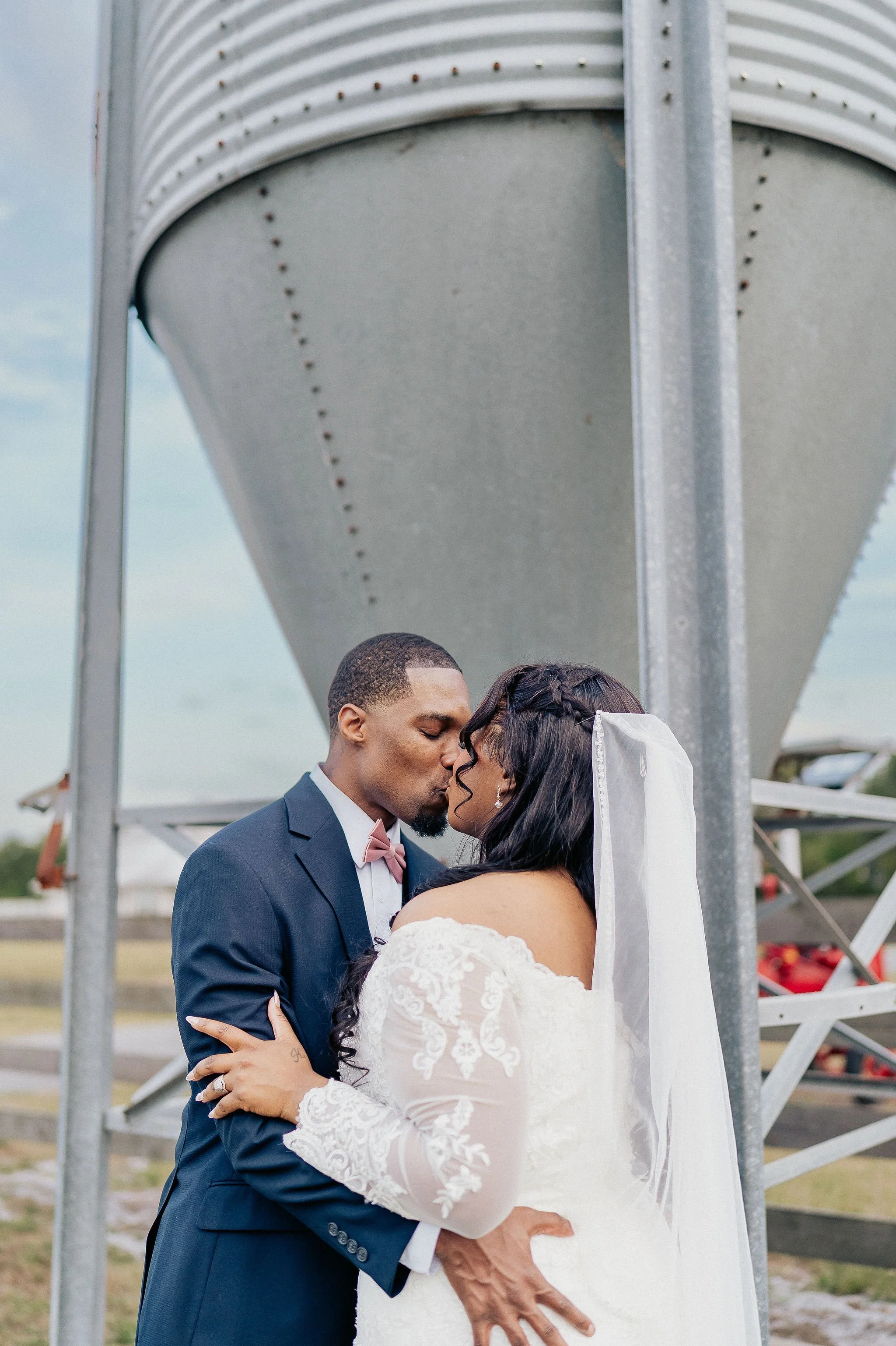 Bride and groom portrait at Brannan’s Barn wedding venue in Jacksonville Florida captured during a 2026 wedding with rustic barn and golden hour light by ARG Foto