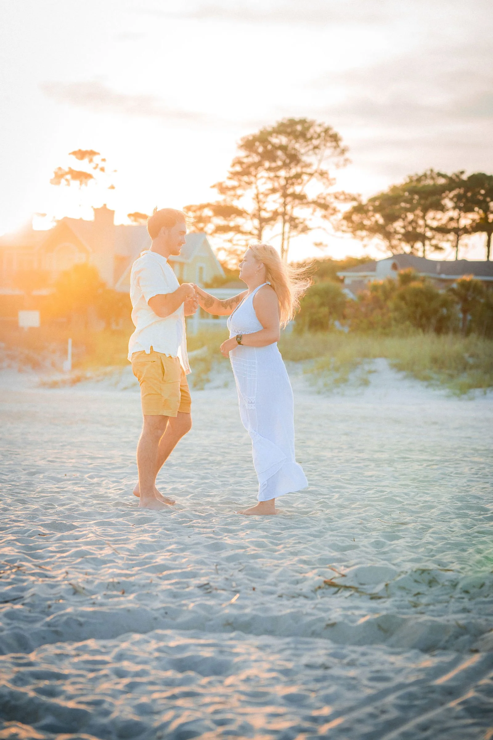 newly engaged couple dancing in beach hilton head sc.jpg