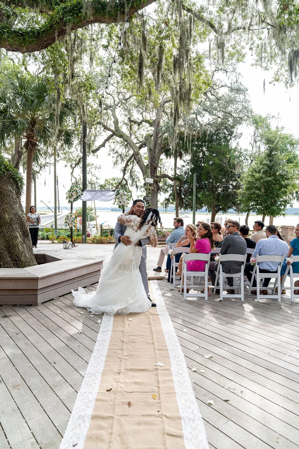 Couple portrait at Oyster Factory Park in Bluffton, South Carolina, during a 2025 wedding—capturing the waterfront beauty of the May River and the timeless Lowcountry atmosphere in an editorial, cinematic style by ARG Foto.