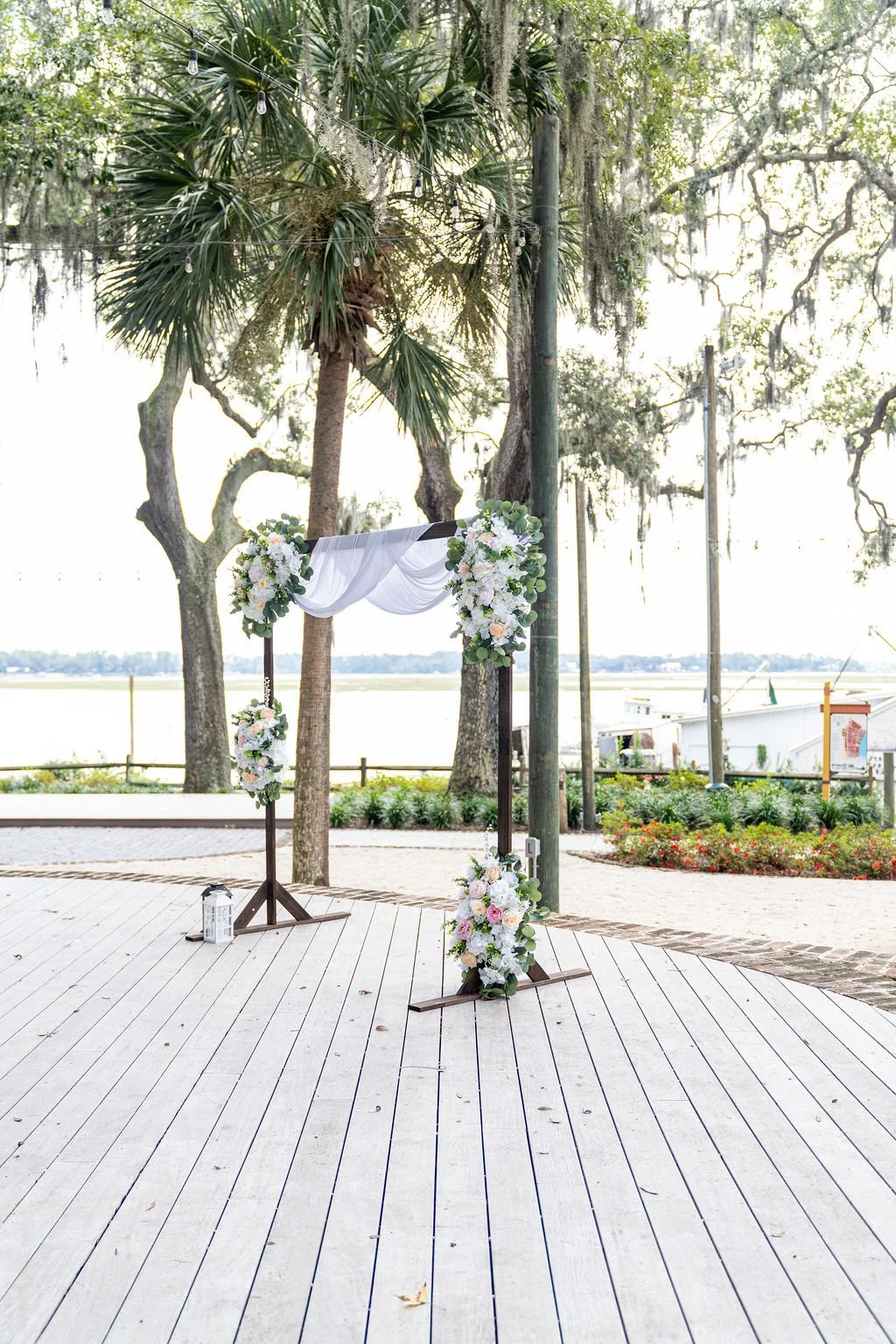 Couple portrait at Oyster Factory Park in Bluffton, South Carolina, during a 2025 wedding—capturing the waterfront beauty of the May River and the timeless Lowcountry atmosphere in an editorial, cinematic style by ARG Foto.