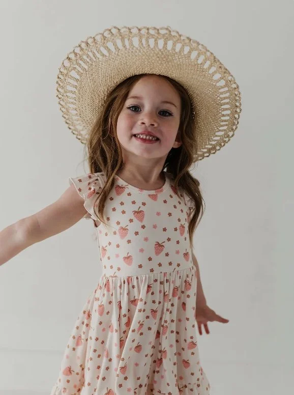 This sleeveless twirl dress brings a little magic to everyday moments. Whether she&rsquo;s spinning through the living room or running free at the playground. The full-circle skirt moves beautifully with her, giving her the freedom to just be a kid. 