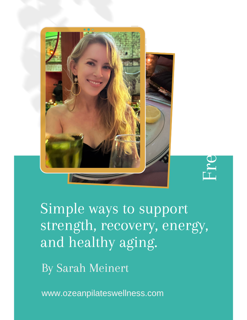 Founder of Ozean is smiling at a restaurant, with a plate of food and drinks in front of her.