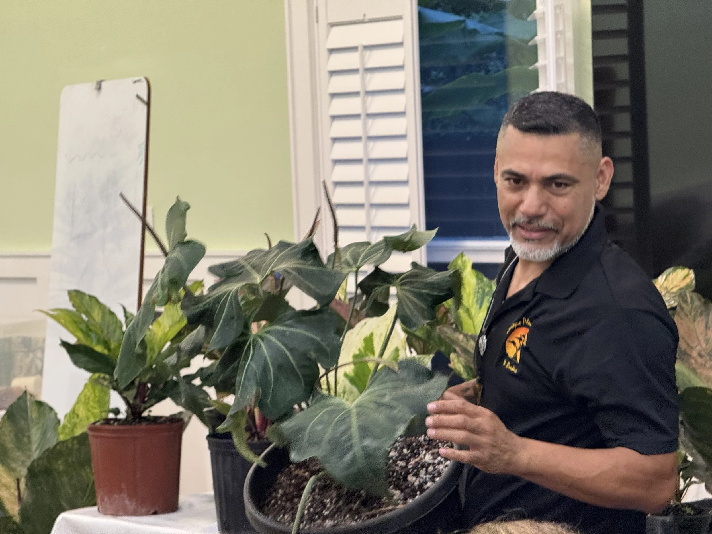 Nacho Duran of Unique Plants Nursery holds an anthurium 
