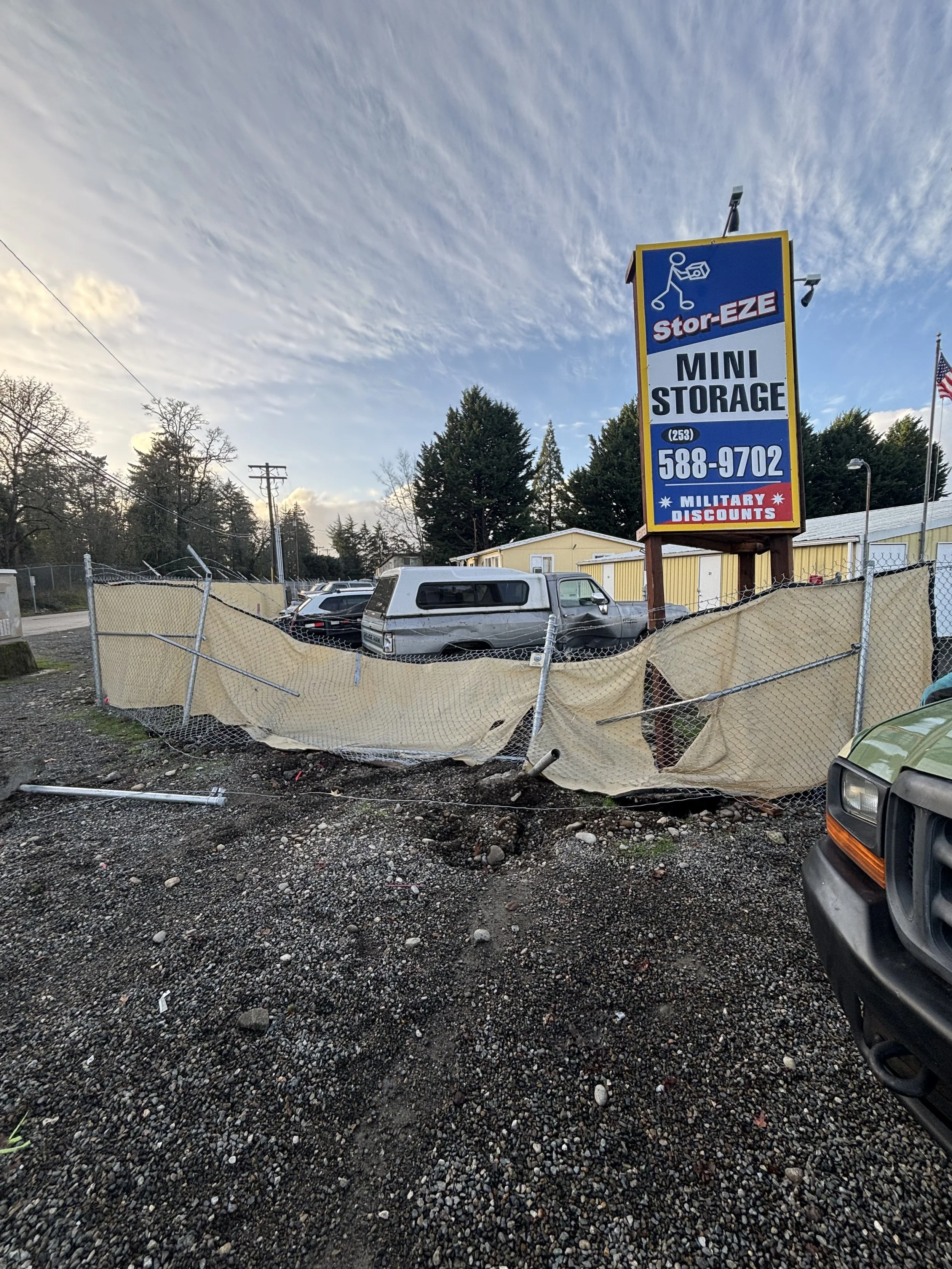 Damaged fence at a storage facility