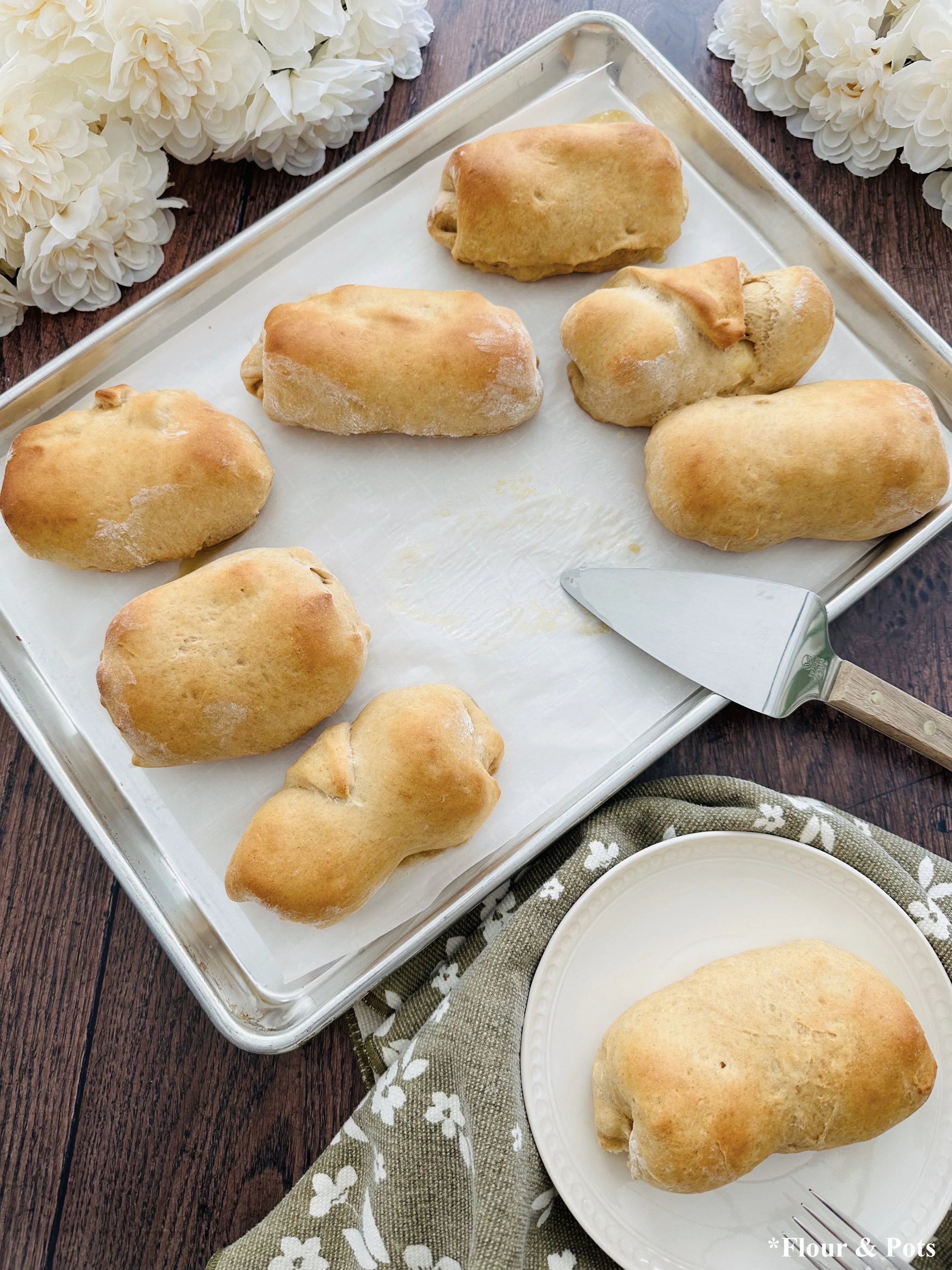 Buttery whole wheat banana bread rolls fresh out of the oven with golden tops