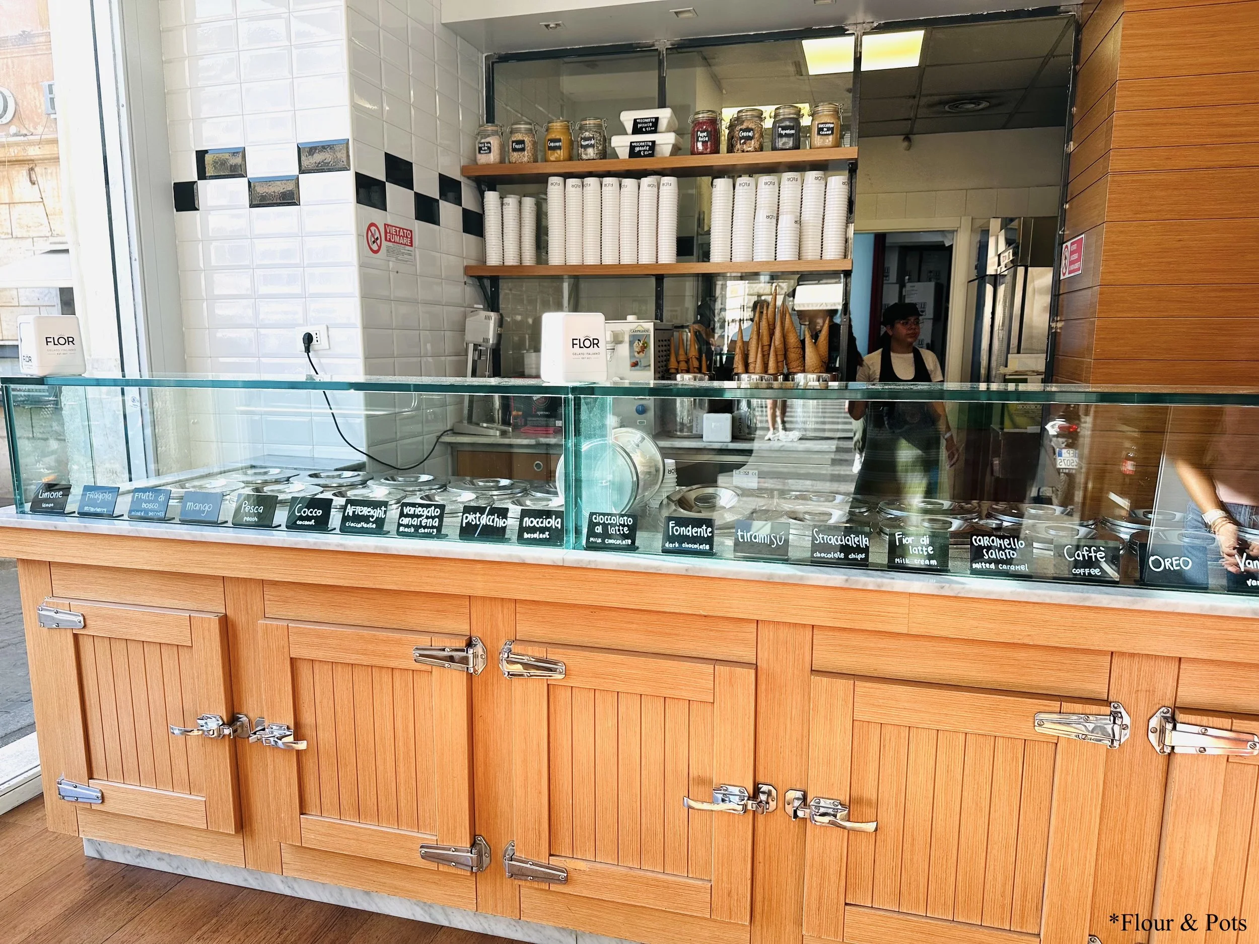Flor Gelato counter in Rome, Italy — bright and clean display filled with colorful gelato flavors, showcasing the shop’s friendly and welcoming atmosphere.