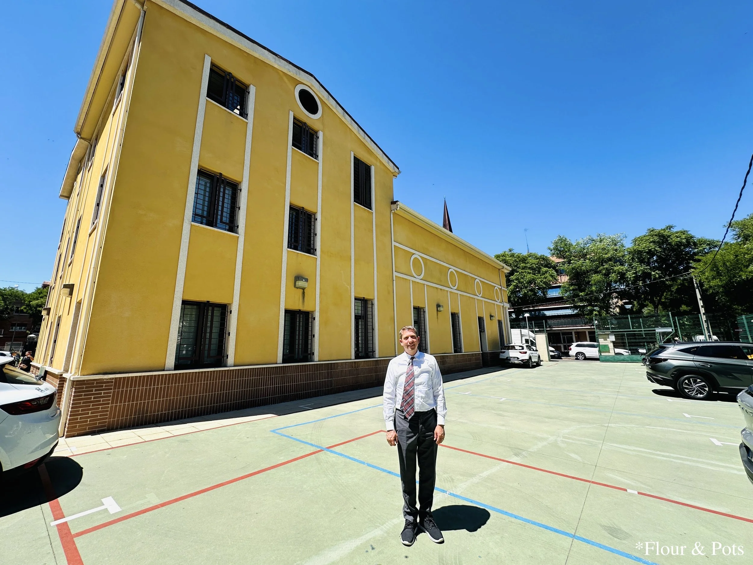 A photo of my dad standing in front of Puerta Bonita Church, near Madrid, Spain, with the historic church in the background.