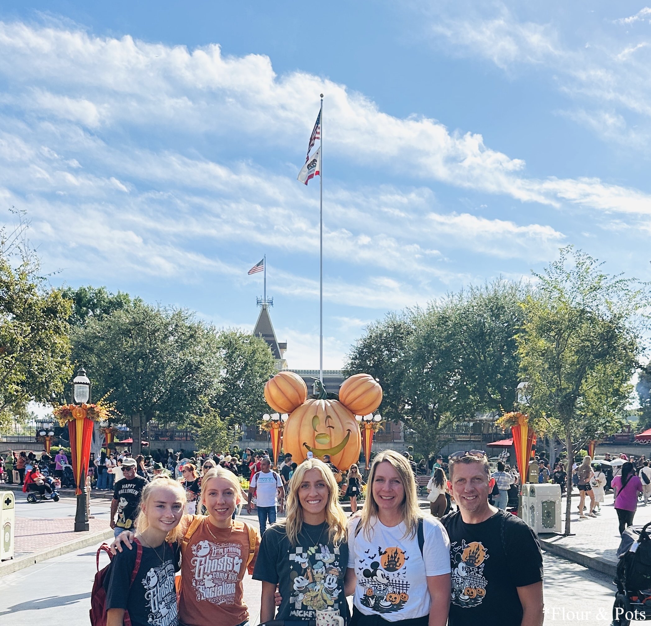 Halloween celebration family photo on Disneyland Main Street.
