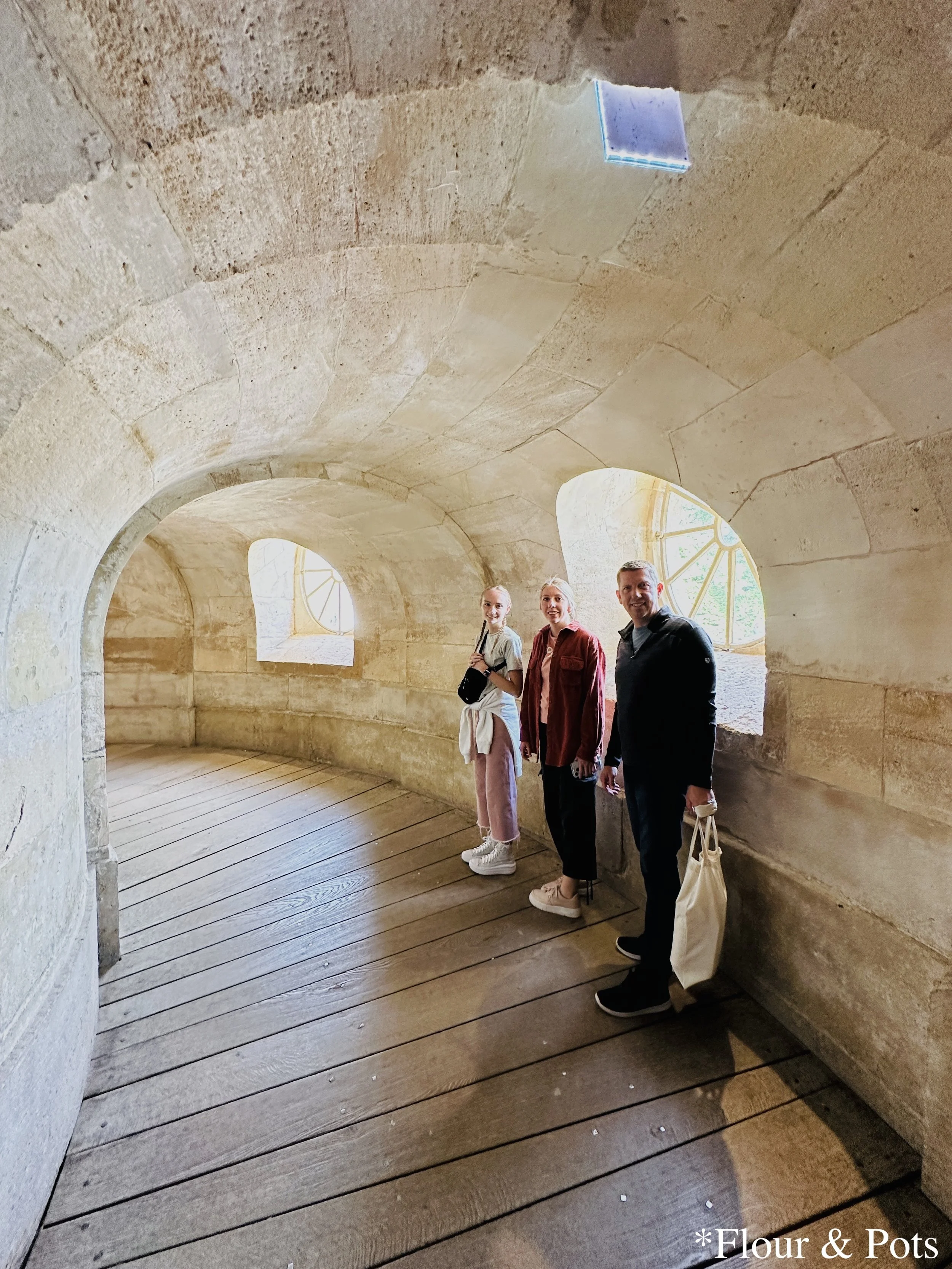 My family standing together inside the hallway of the main building at Queen’s Hamlet, Palace of Versailles.