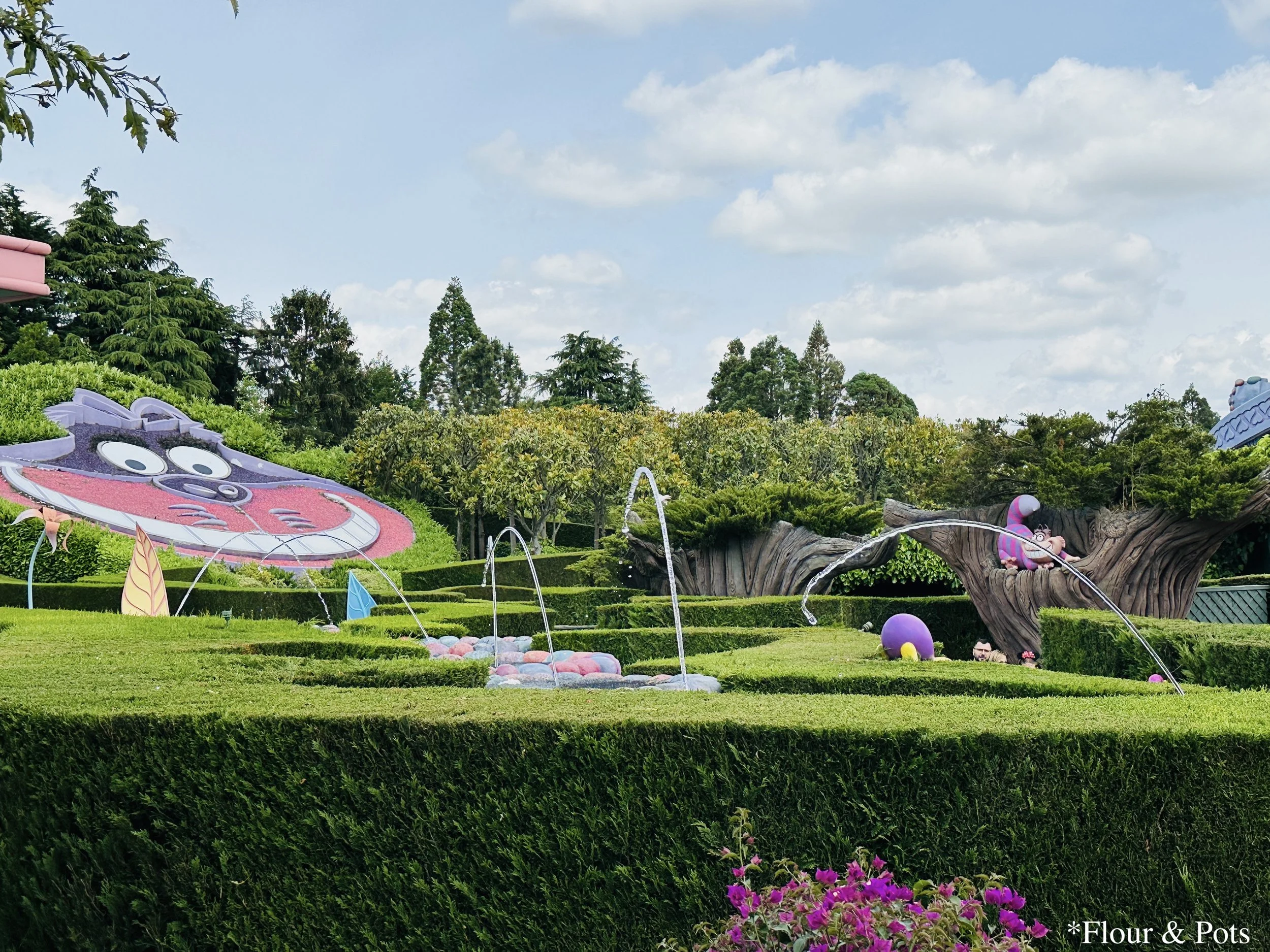 View of Alice’s Curious Labyrinth maze attraction near It’s a Small World in Disneyland Paris, inspired by Alice’s journey through Wonderland.