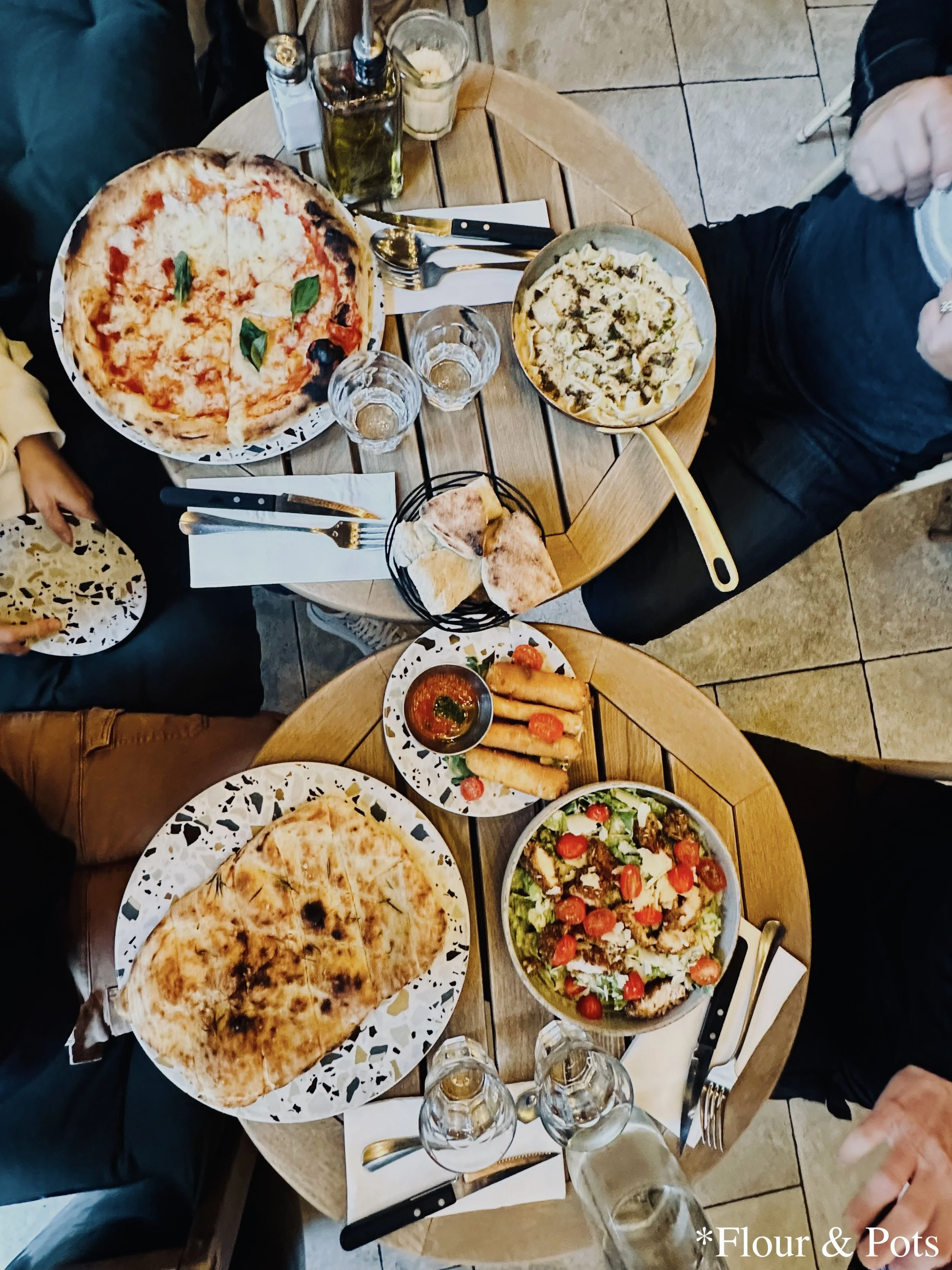 Dinner spread of Italian food from Bianca restaurant in Paris, France.