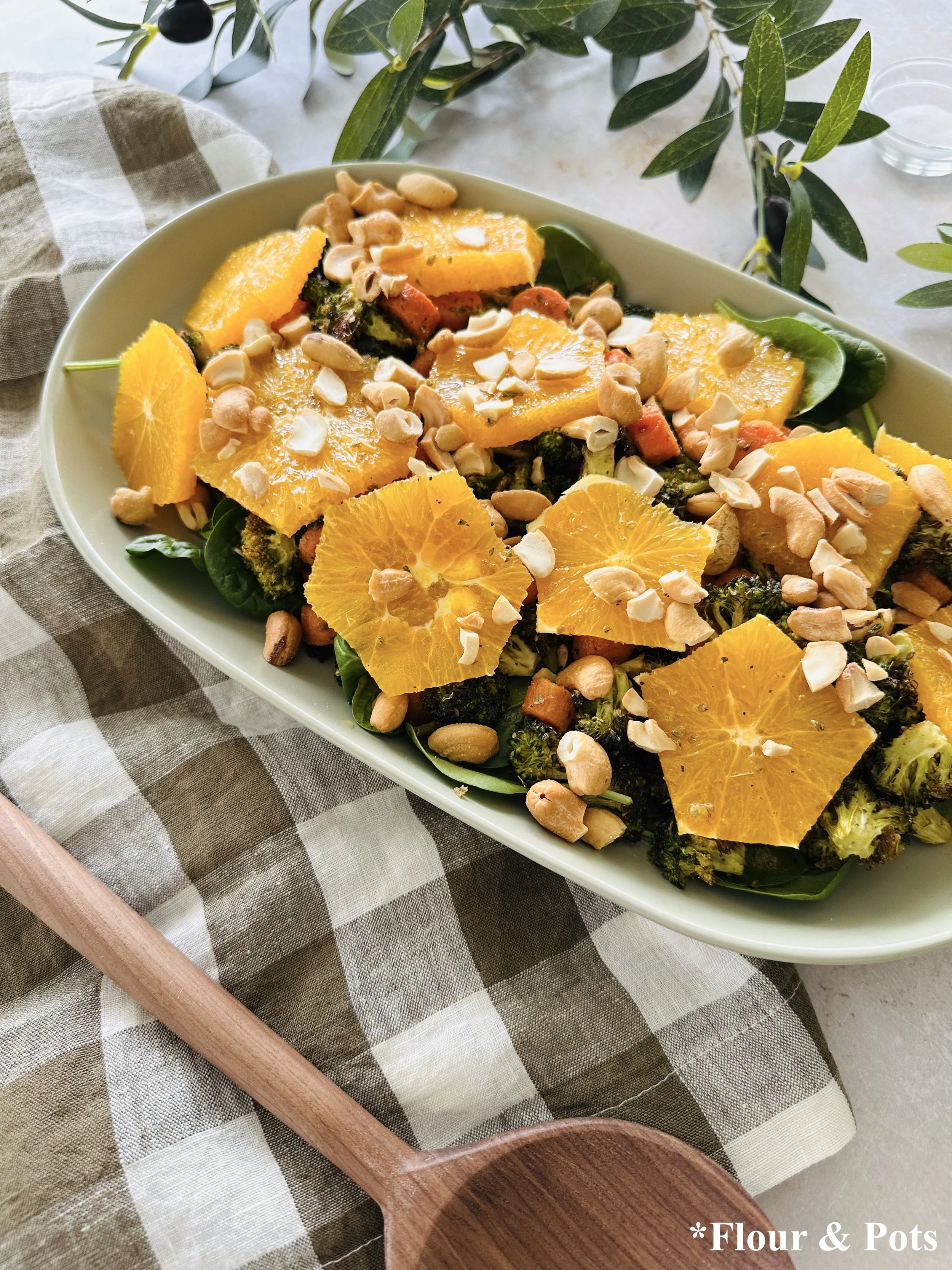 Bright citrus salad with spinach, oranges, and crunchy cashews.