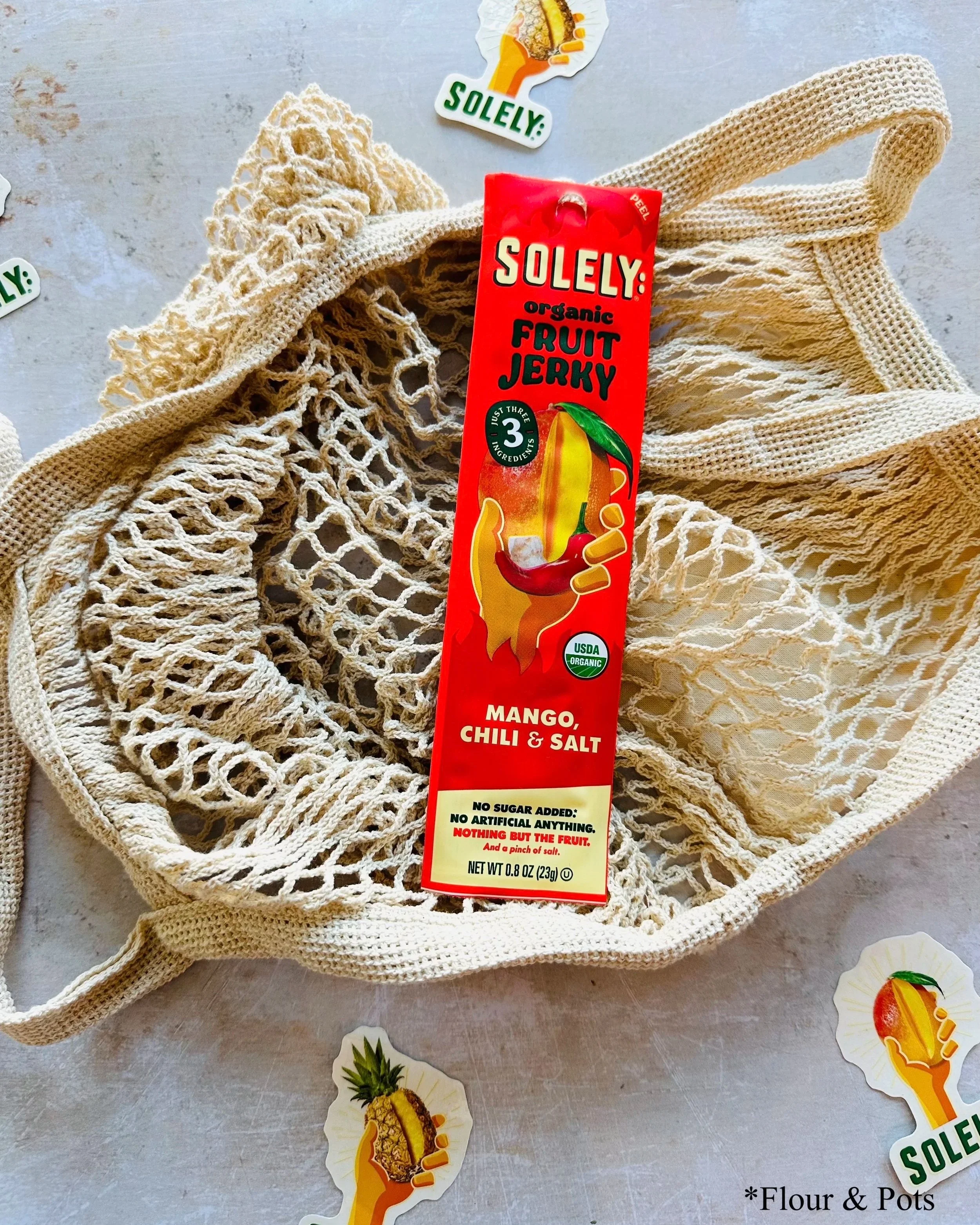 Solely Organic Mango, Chili & Salt fruit jerky stick package with vibrant, bold design.
