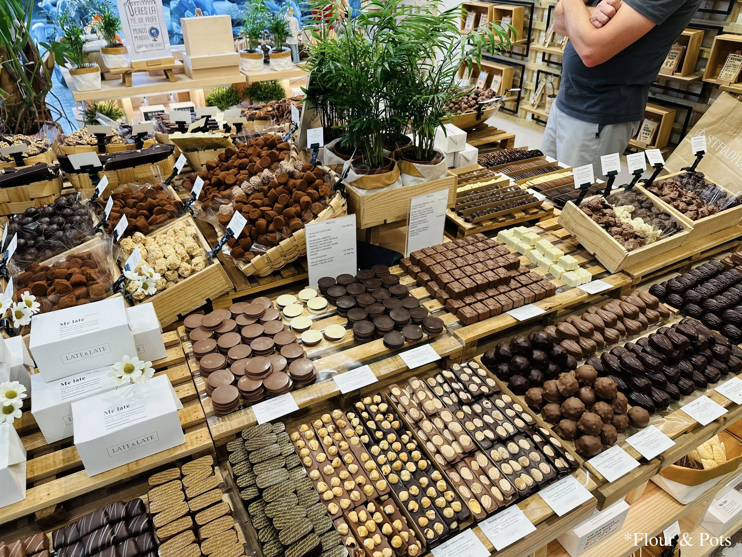 Inside Late & Late Chocolate in Madrid, Spain, showcasing a colorful display of artisanal chocolates, ready to be enjoyed.