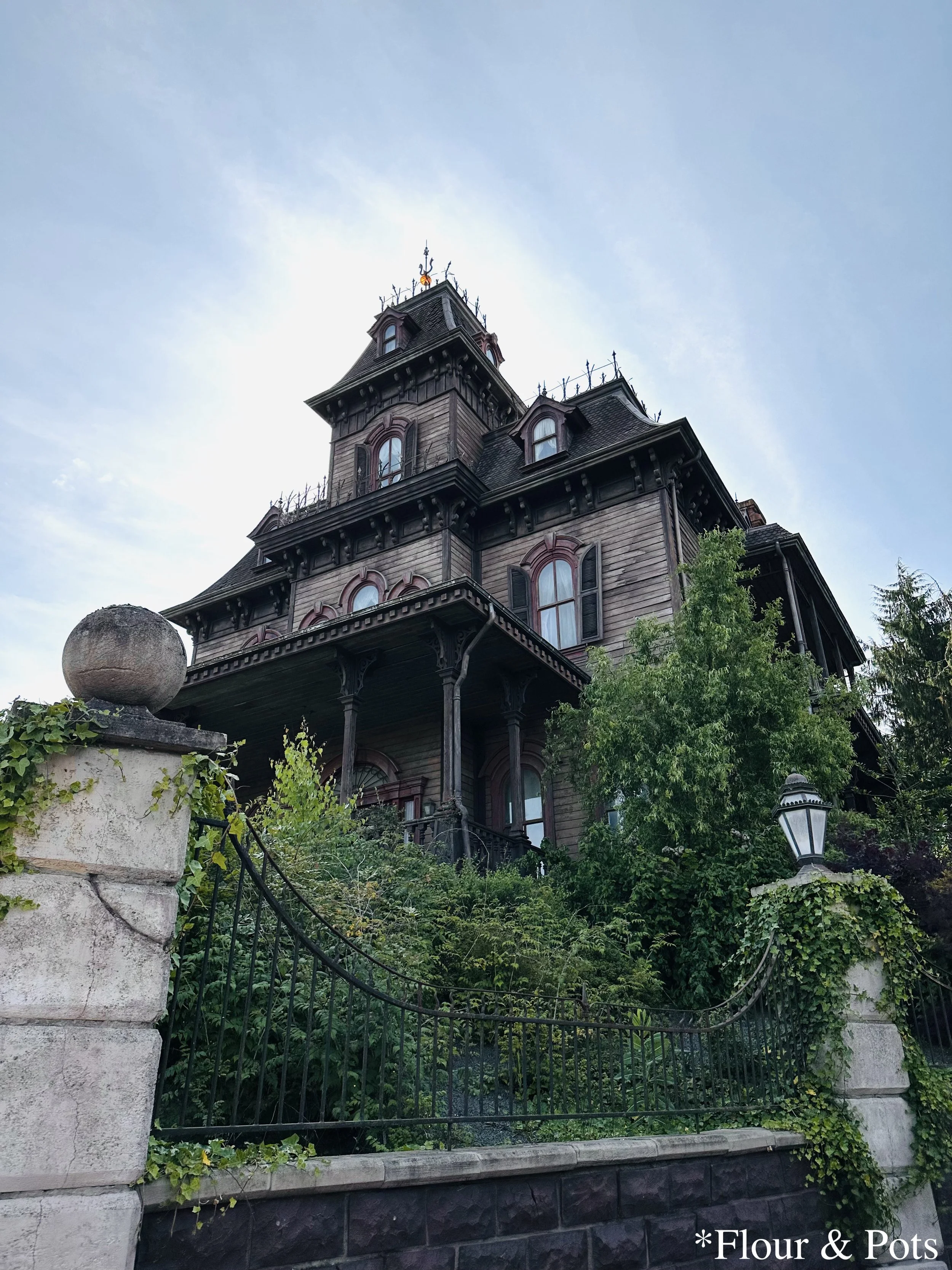 Close-up view of Phantom Manor, the haunted house attraction at Disneyland Paris, showcasing its intricate gothic architecture and eerie details.