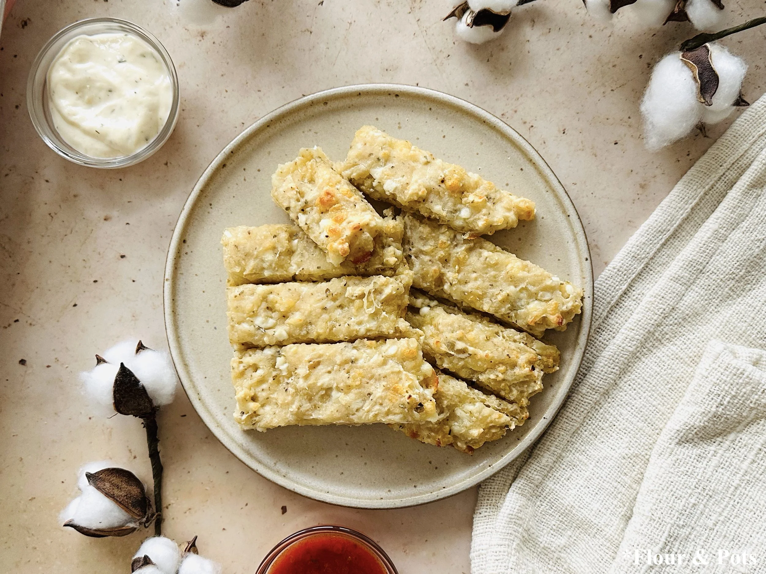 Close-up of soft, pull-apart cottage cheese breadsticks with a golden crust.