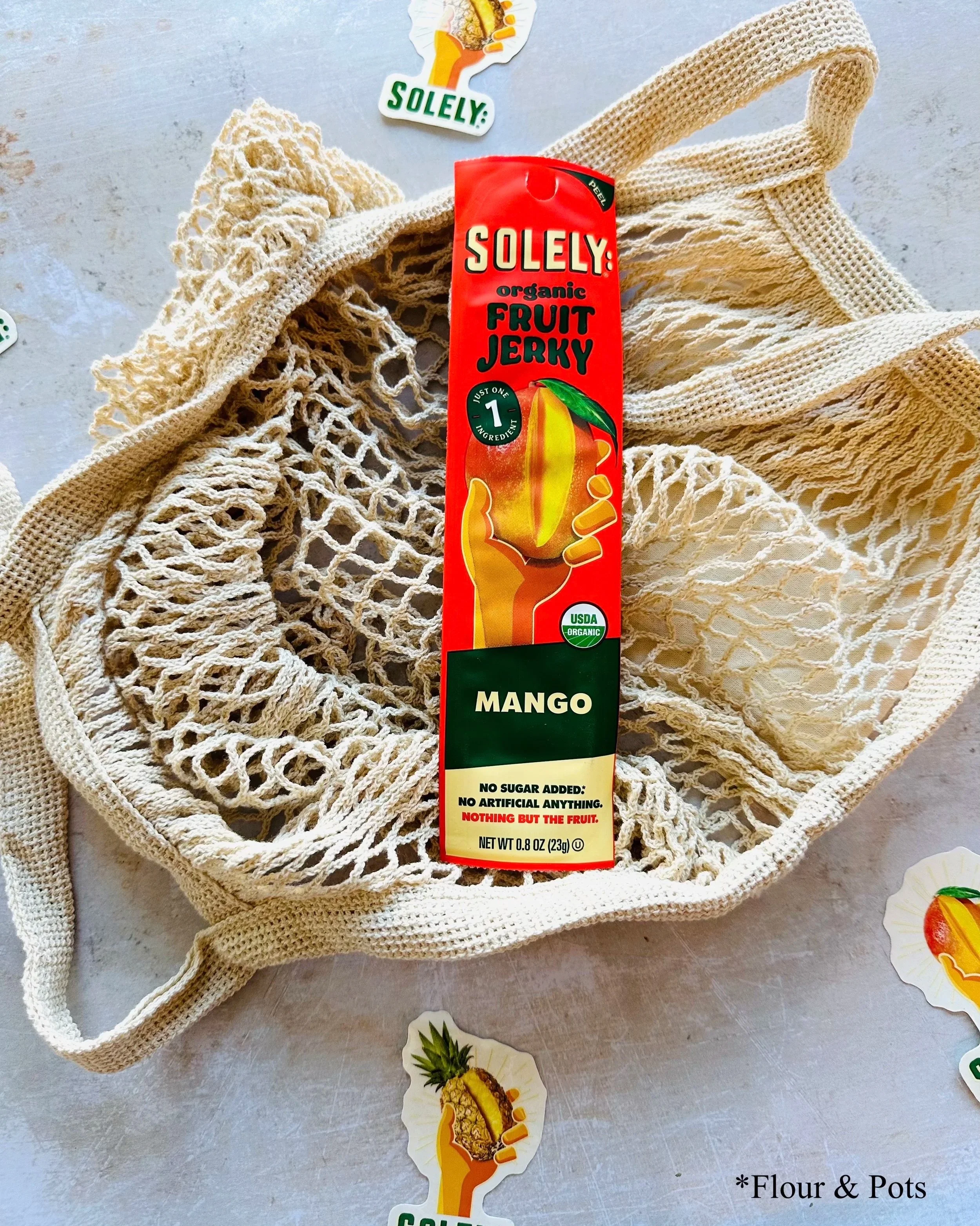 Solely Organic Mango fruit jerky stick package featuring a bright, tropical mango design.