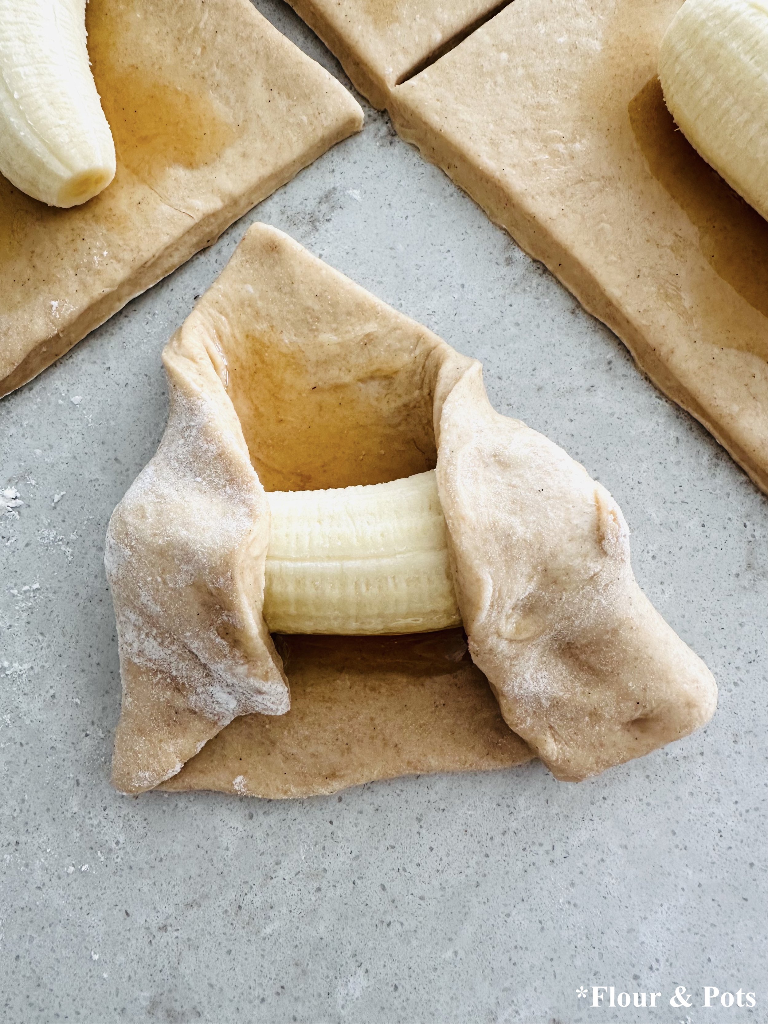 Bread Dough with a banana being rolled up