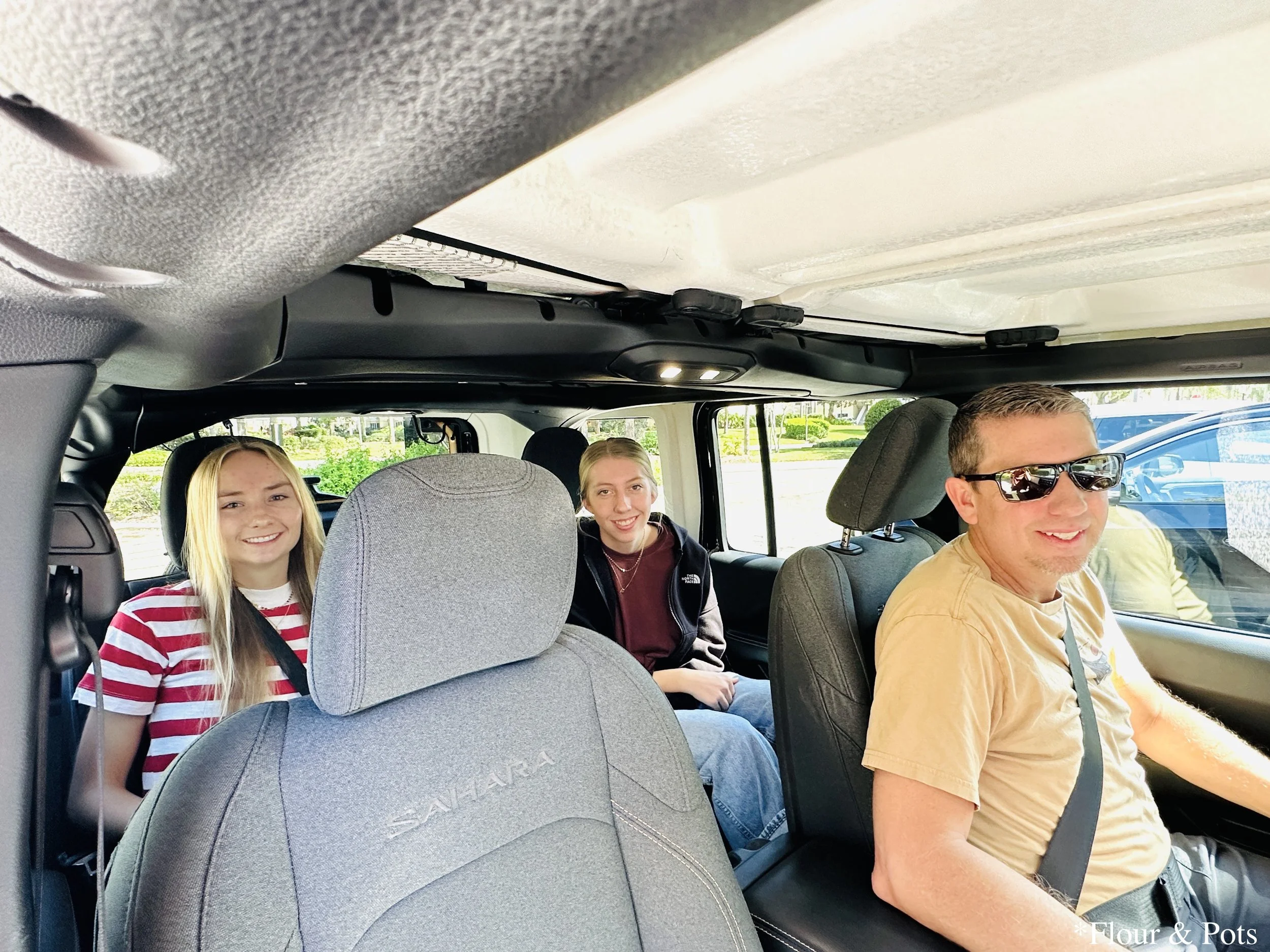 Family photo taken inside a Jeep 4x4 Renegade rental car, just before heading out on our first day of adventure in Orlando, Florida.