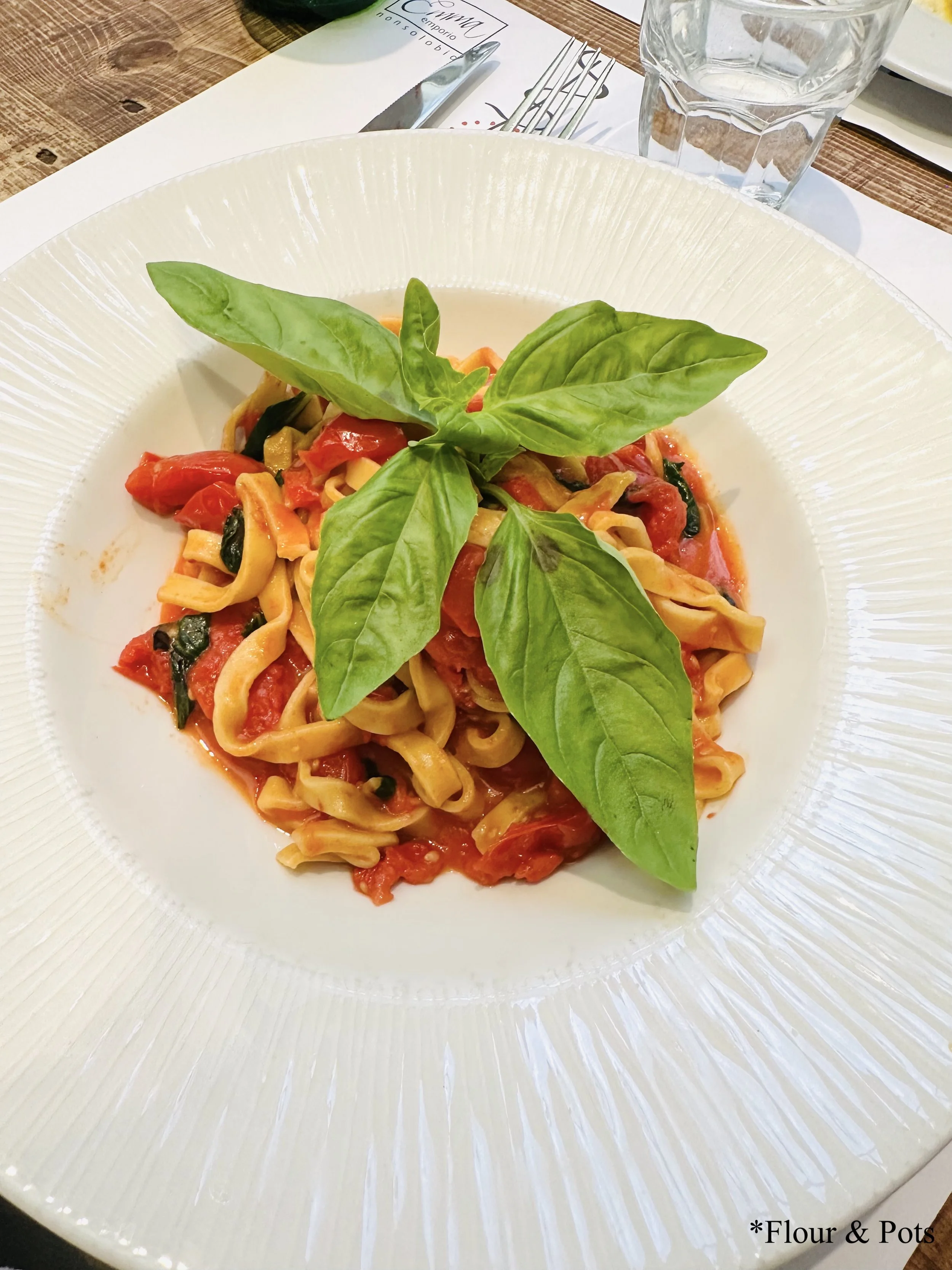 Tomato and basil pasta from Emma in Rome, Italy — fresh spaghetti tossed with sweet Sicilian date tomatoes and fragrant basil in a light, flavorful sauce.