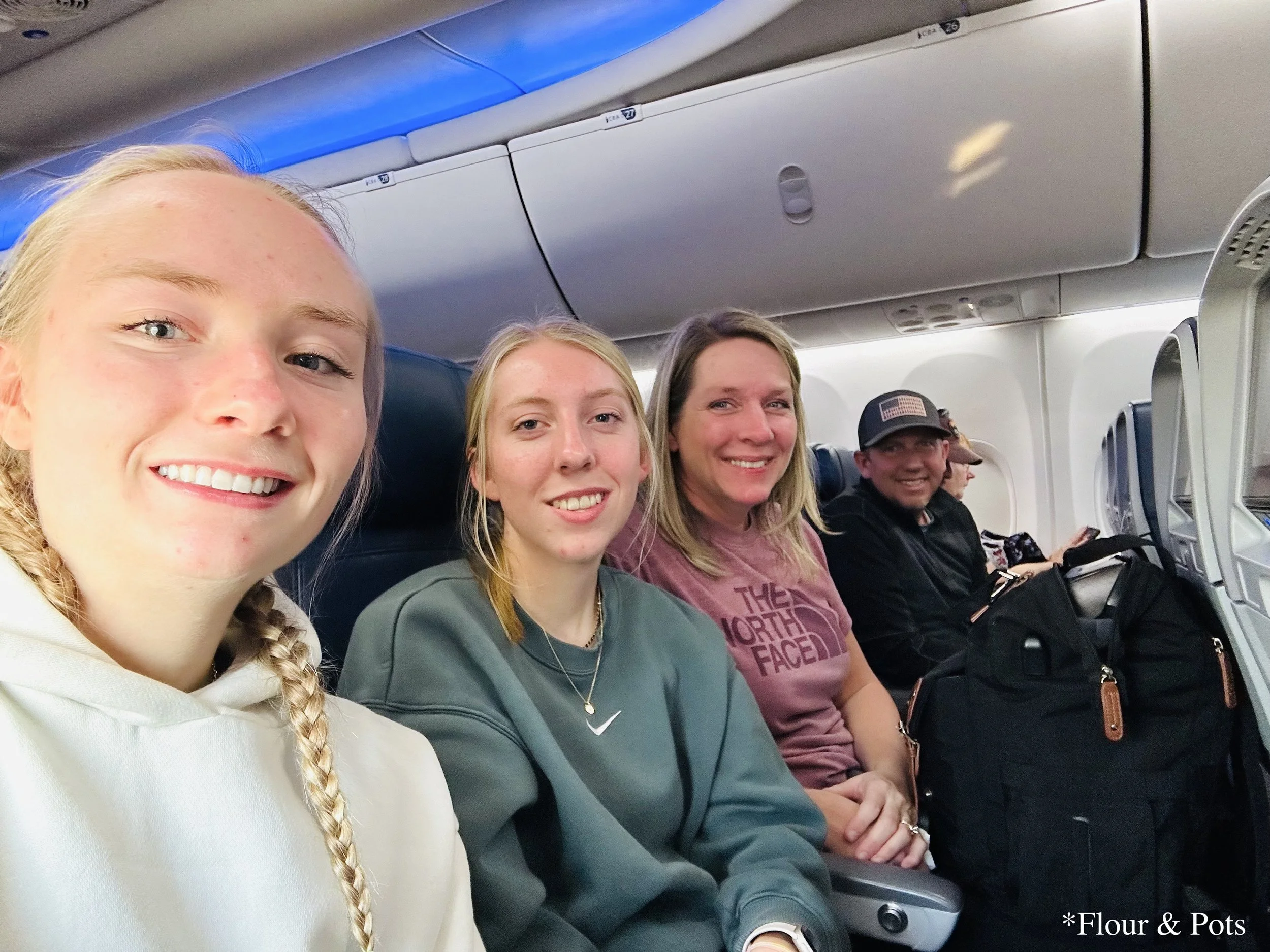 amily selfie seated on the plane before takeoff from Orlando International Airport (MCO) to Salt Lake City (SLC).