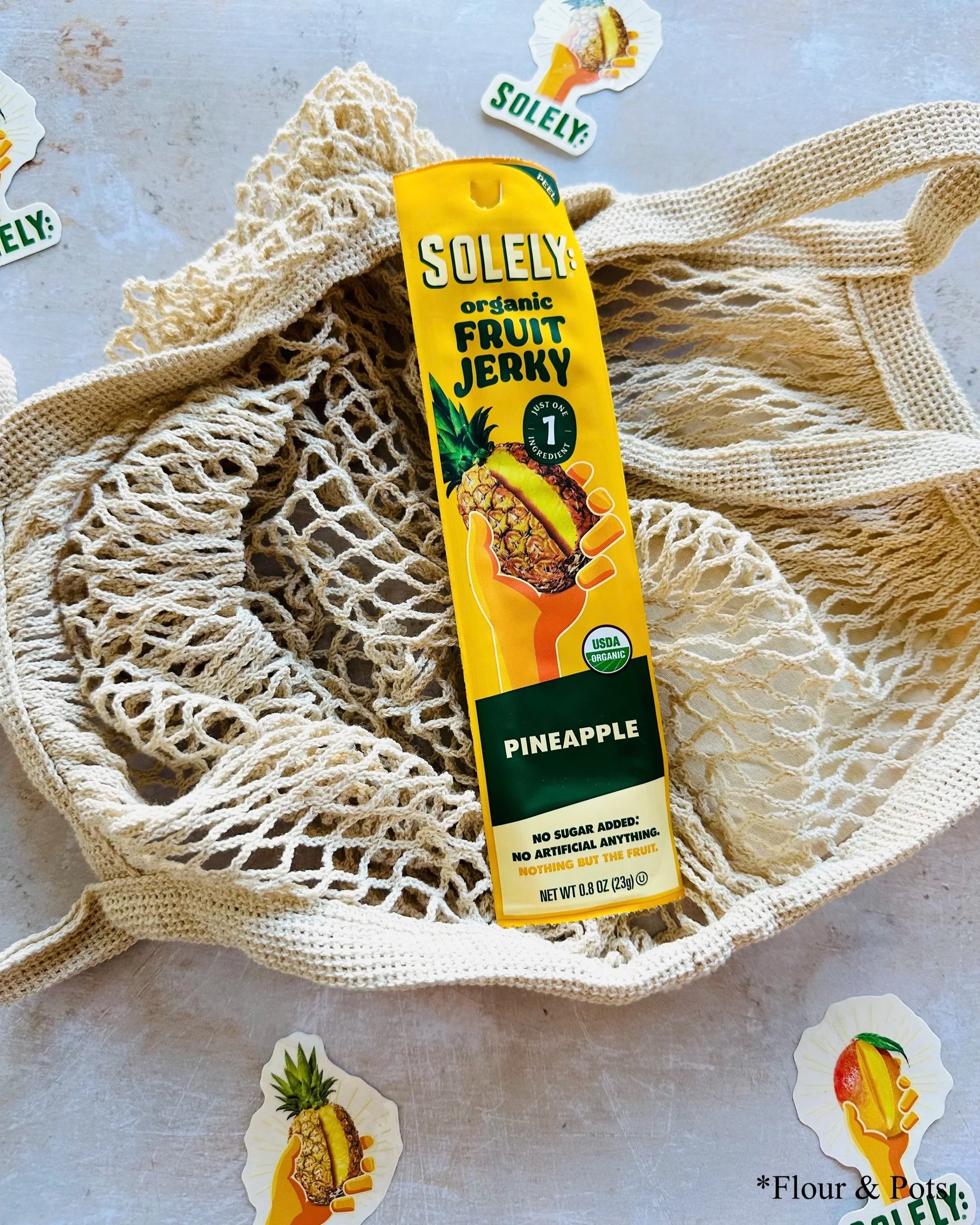 Solely Organic Pineapple fruit jerky stick package with a bright, pineapple-inspired design.
