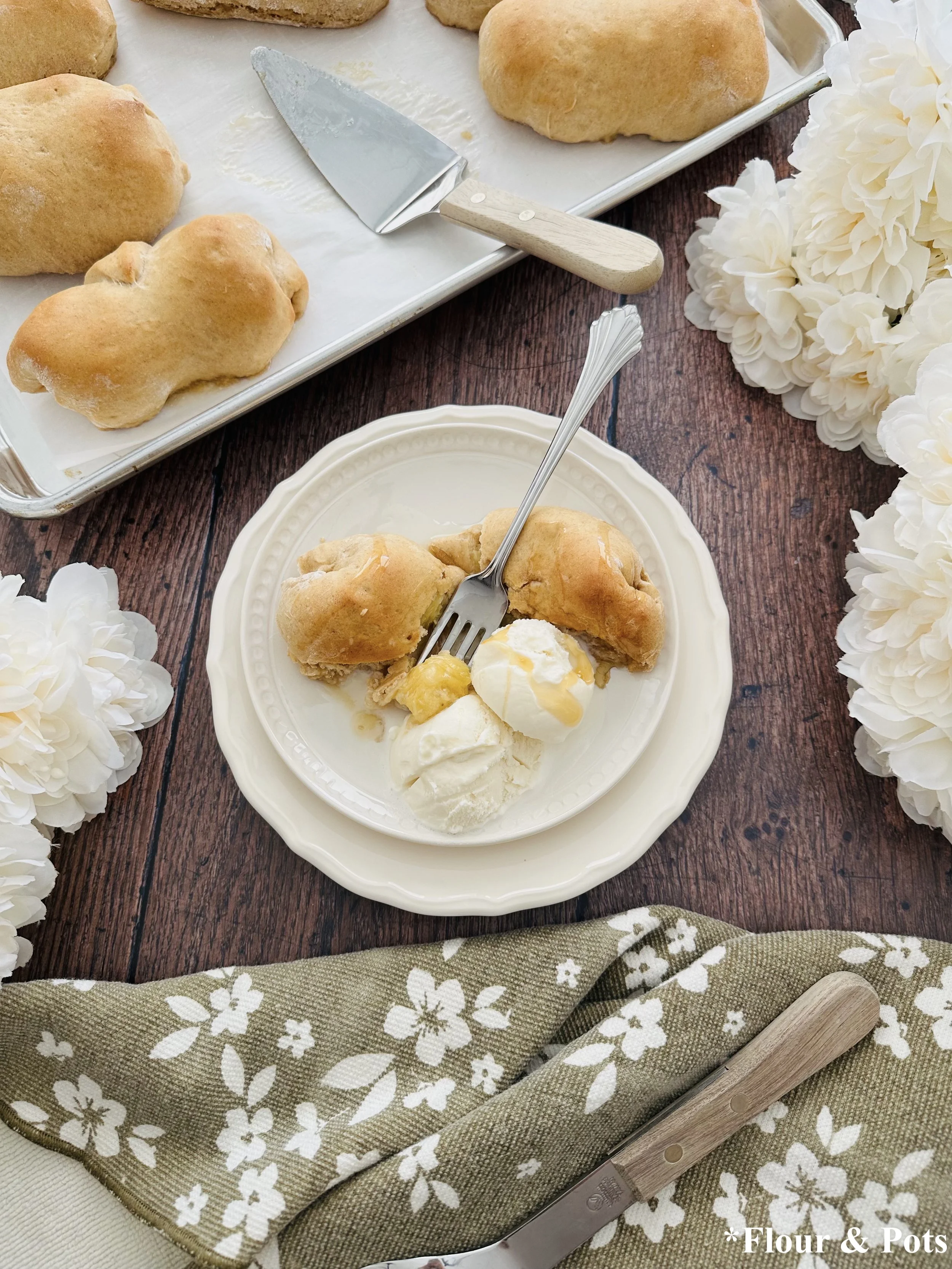 Rustic honey banana bread rolls served with melt vanilla ice cream and a drizzle of honey