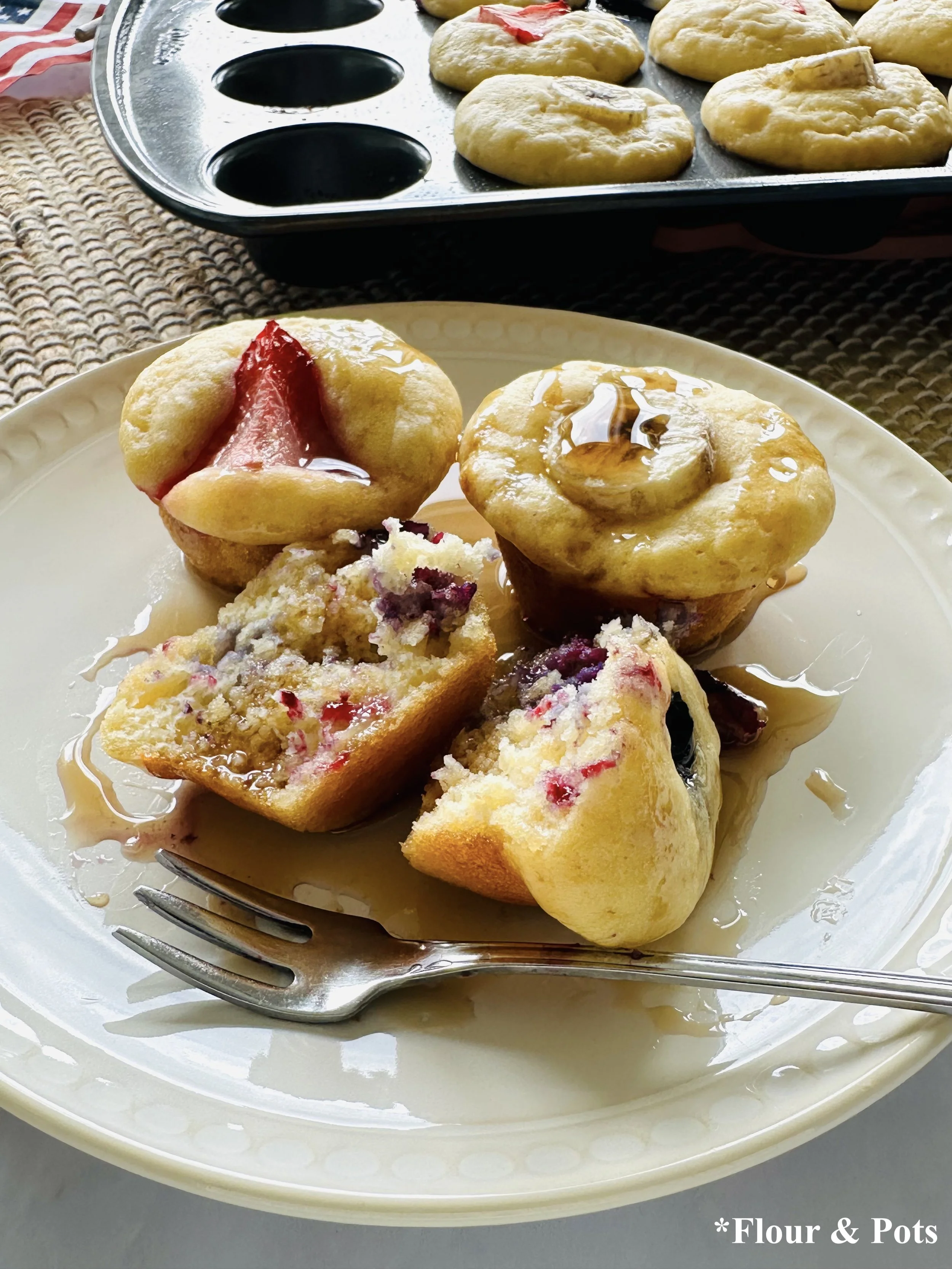 Healthy mini pancake muffins made with fresh berries, bananas, and maple syrup for the Fourth of July.