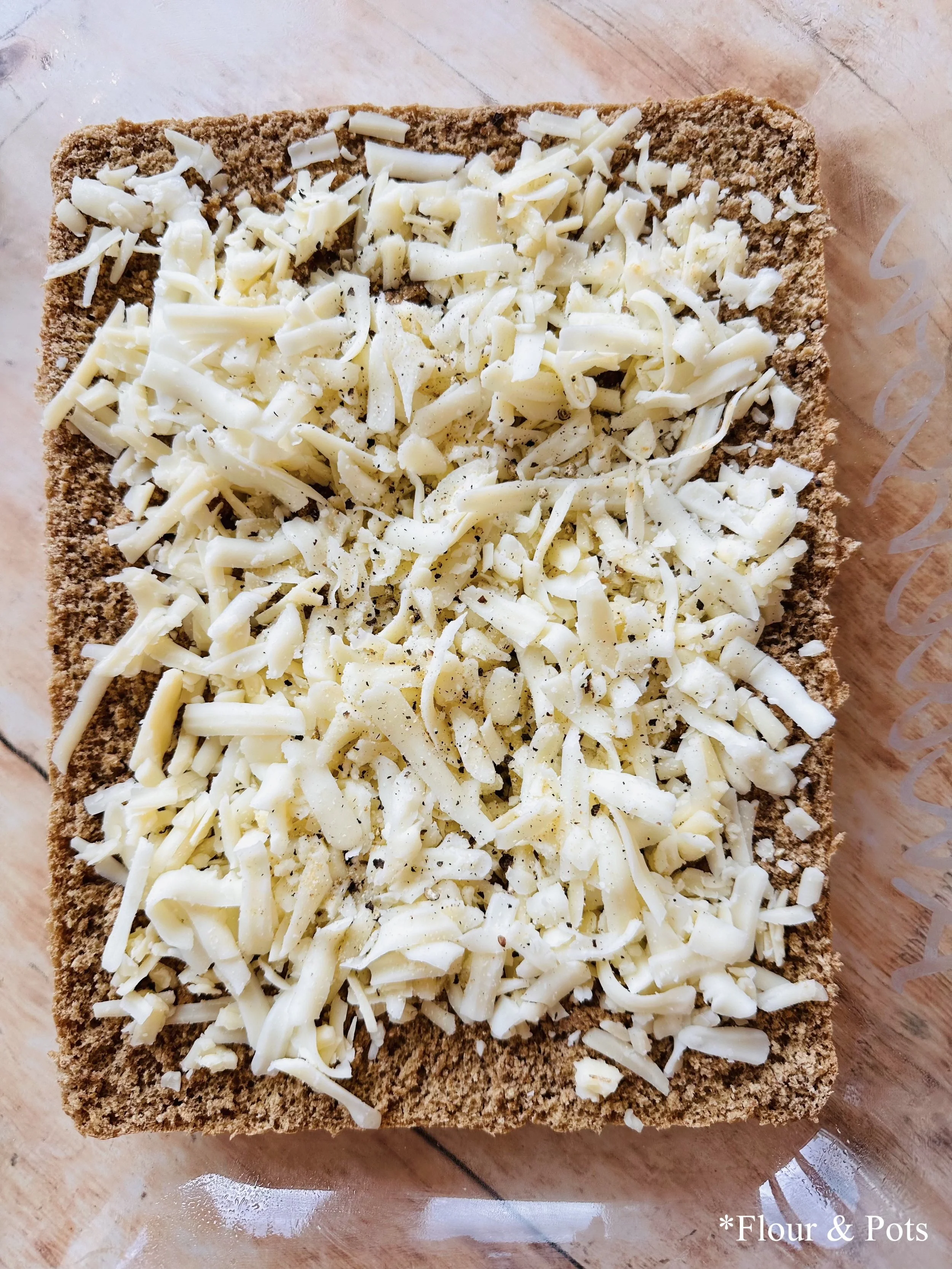 Close-up of the bottom half of herby baked chicken sliders.