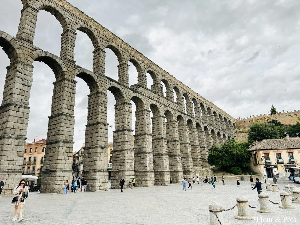 A central view of the Segovia Aqueducts, showcasing the iconic stone arches in the heart of the city.