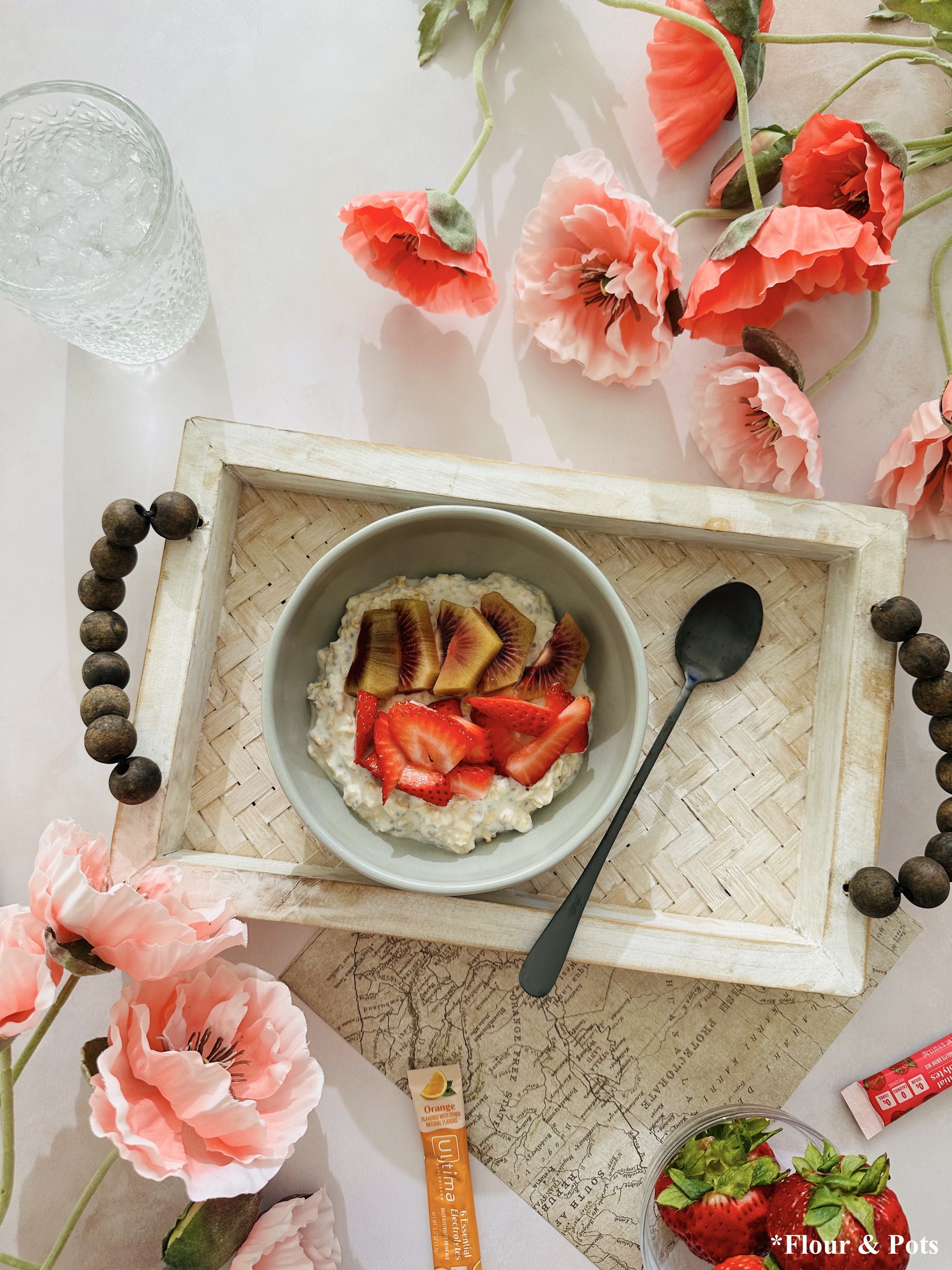 Hydrating overnight oats made with electrolyte drink mix and topped with fresh summer fruit