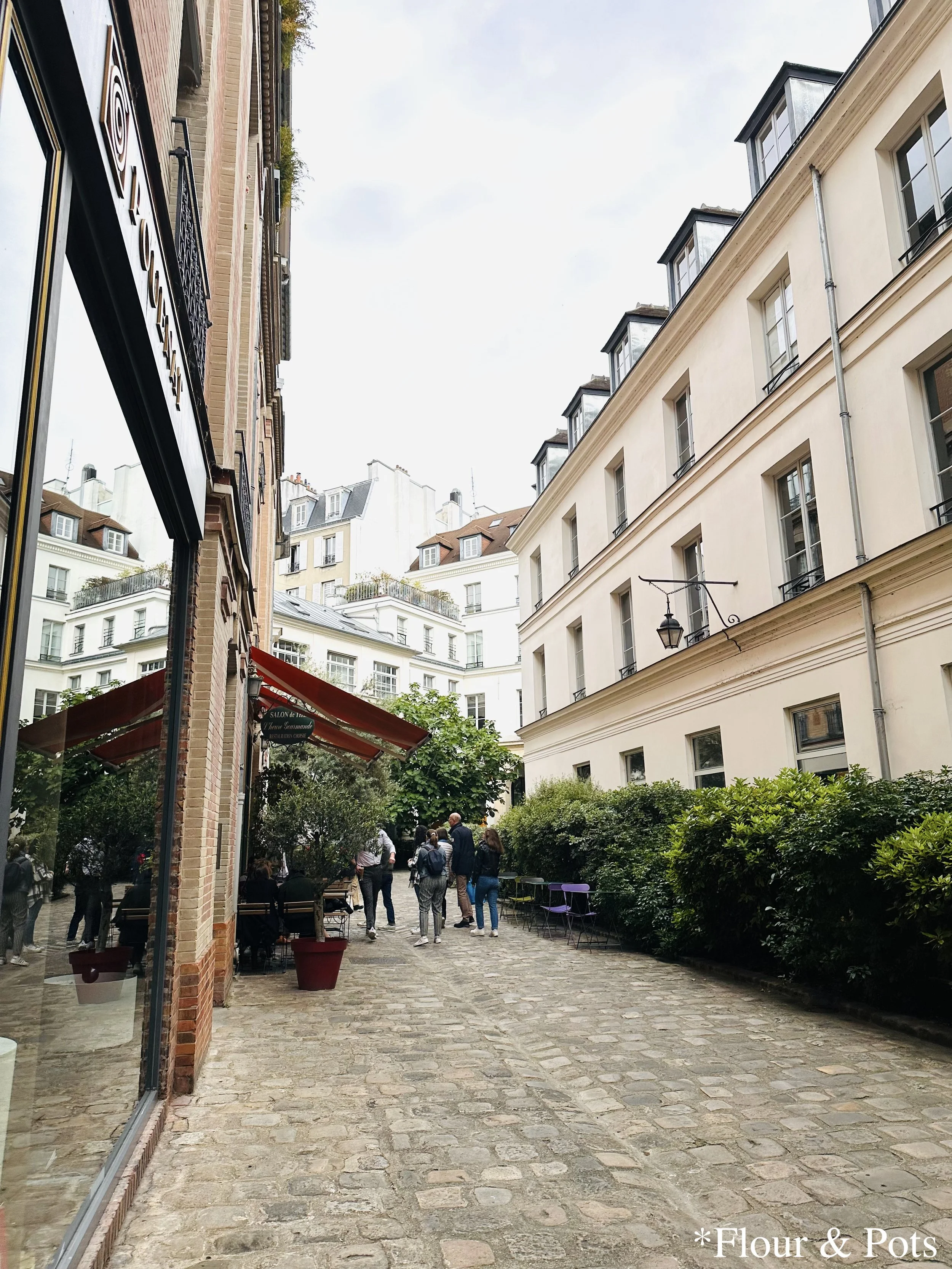 A cute, old-fashioned Parisian street lined with cobblestones in Paris, France.