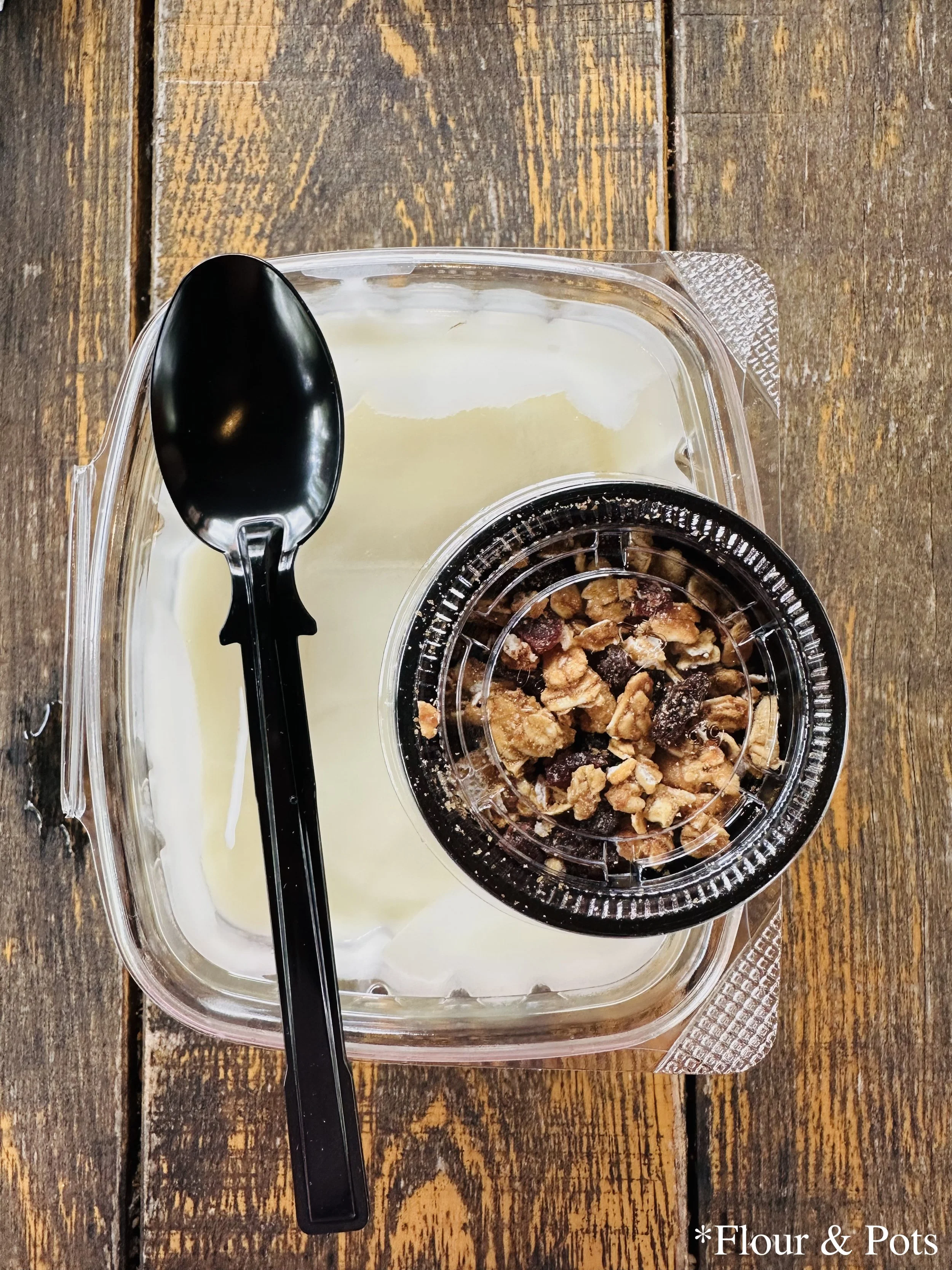 A fruit and yogurt parfait served at Yak & Yeti Local Food Café in Disney's Animal Kingdom, Orlando, Florida, layered with creamy yogurt, fresh berries, and crunchy granola.