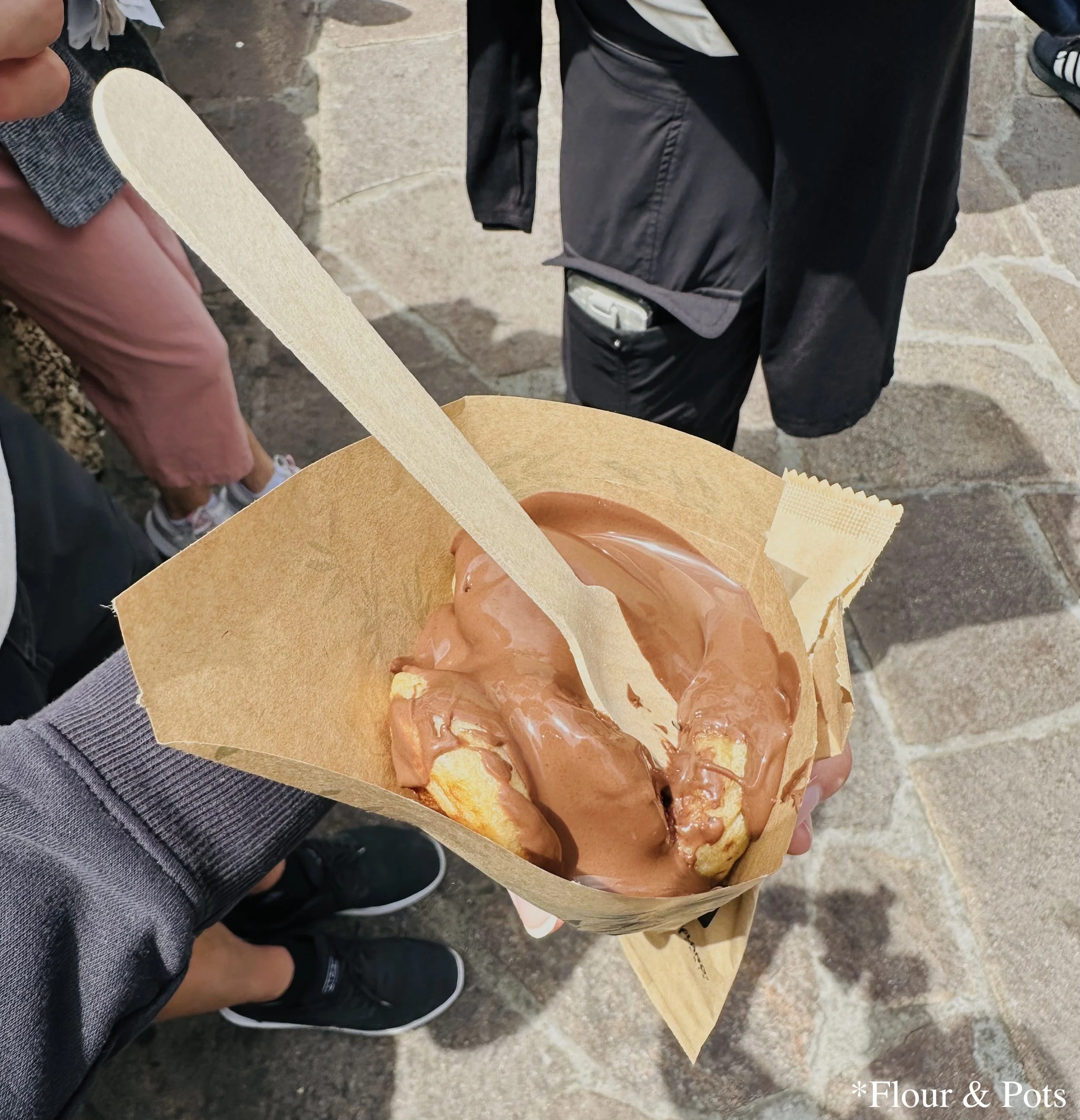Danish pancakes generously topped with a thick layer of Nutella, served at The Old Mill near It’s a Small World in Disneyland Paris.