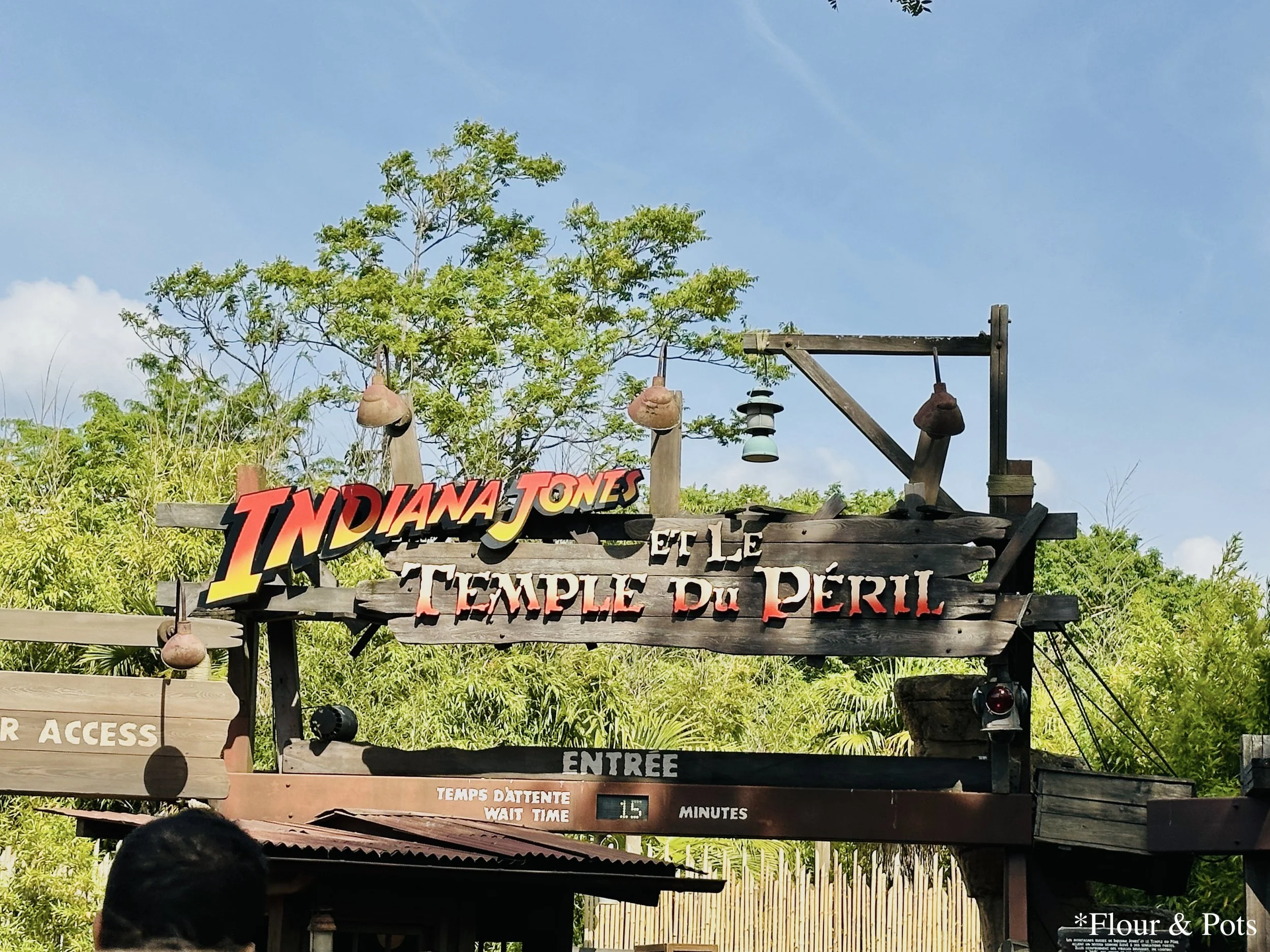 ntrance sign for the Indiana Jones ride at Disneyland Paris, marking the beginning of the queue area surrounded by adventure-themed décor.