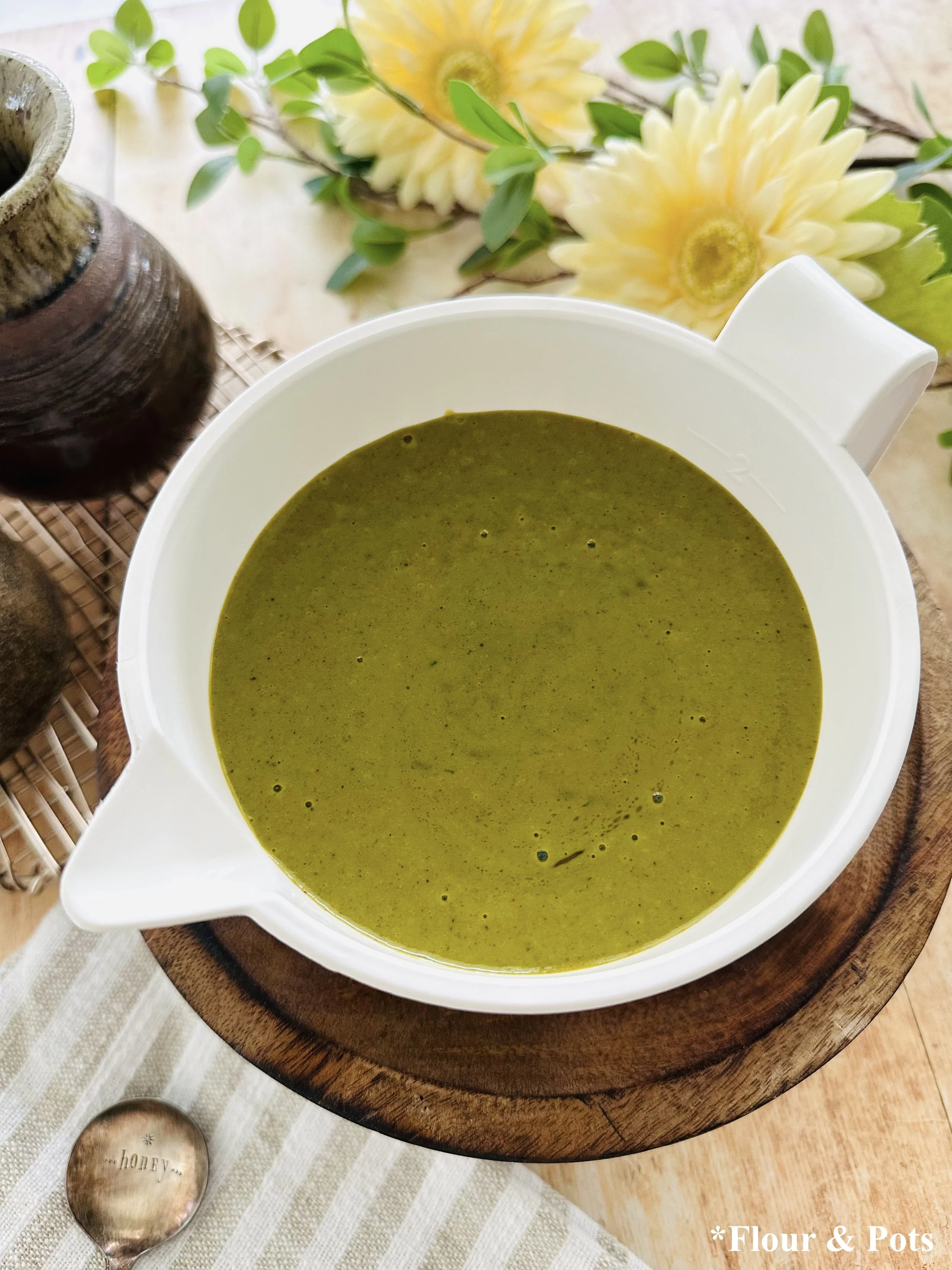 Homemade cilantro vinaigrette dressing with olive oil, honey, and spices