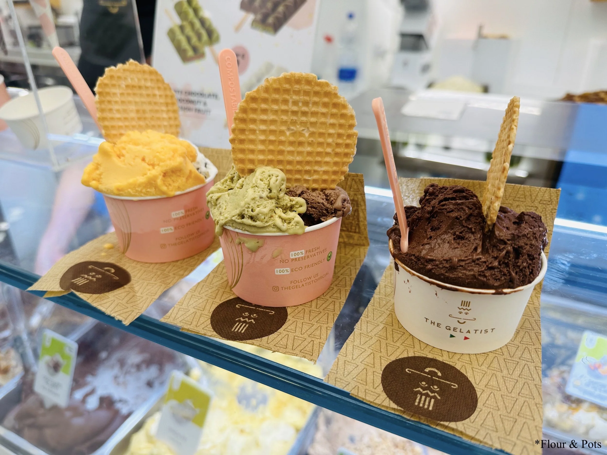 Three cups of colorful gelato in different flavors from The Gelatist in Rome, Italy.