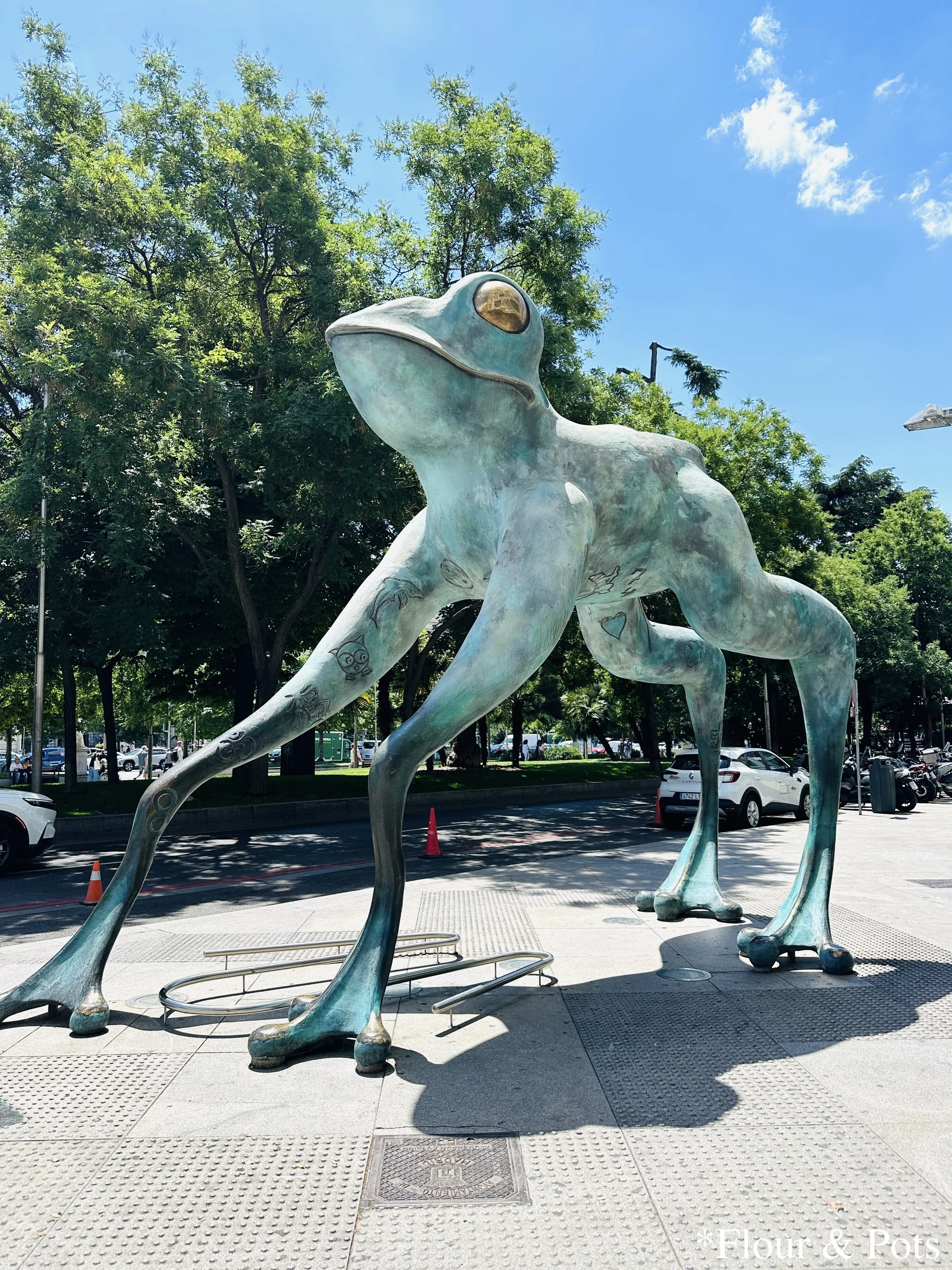 A piece of art featuring a blue frog in Madrid, Spain.